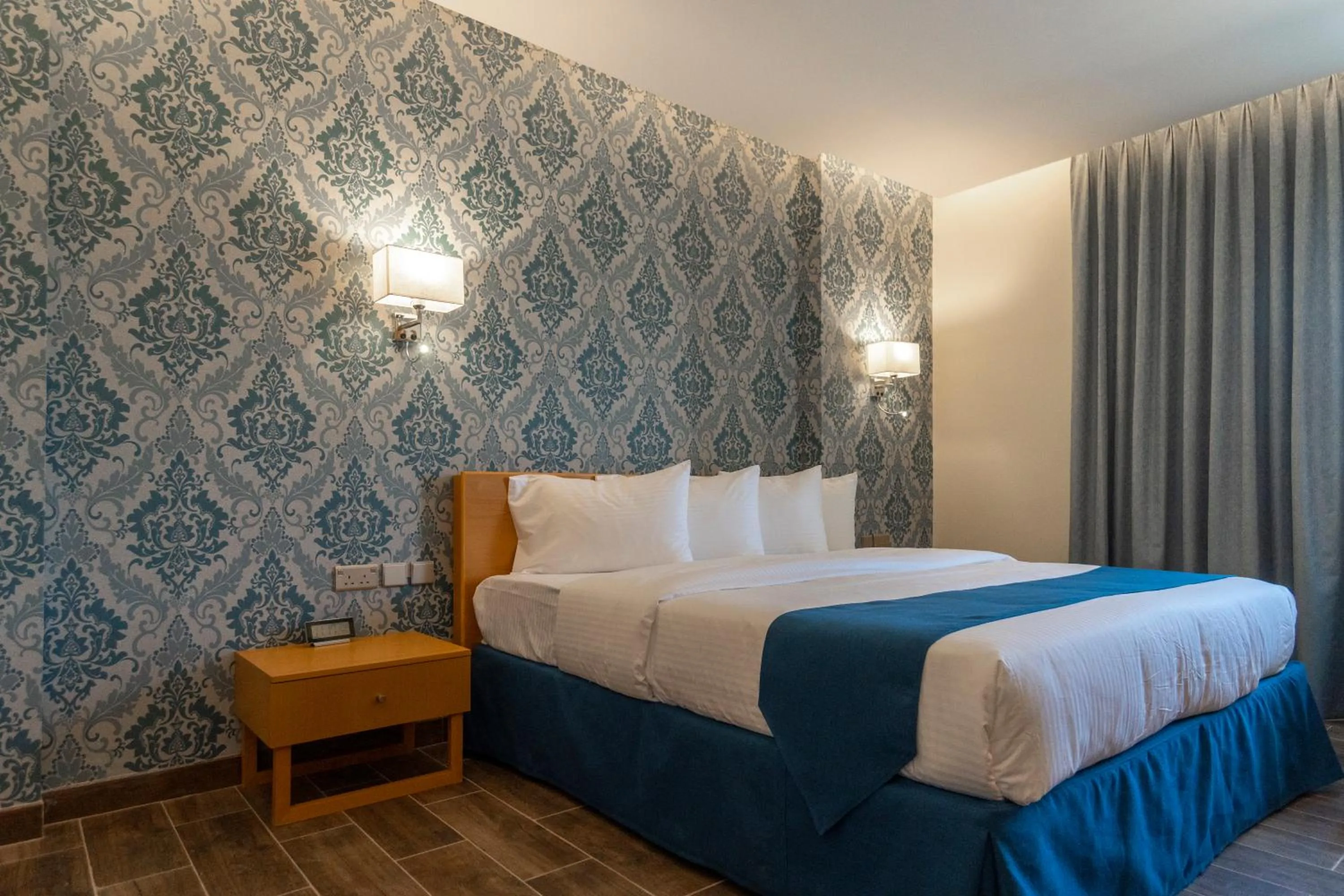 Bed in Sama Muscat Hotel