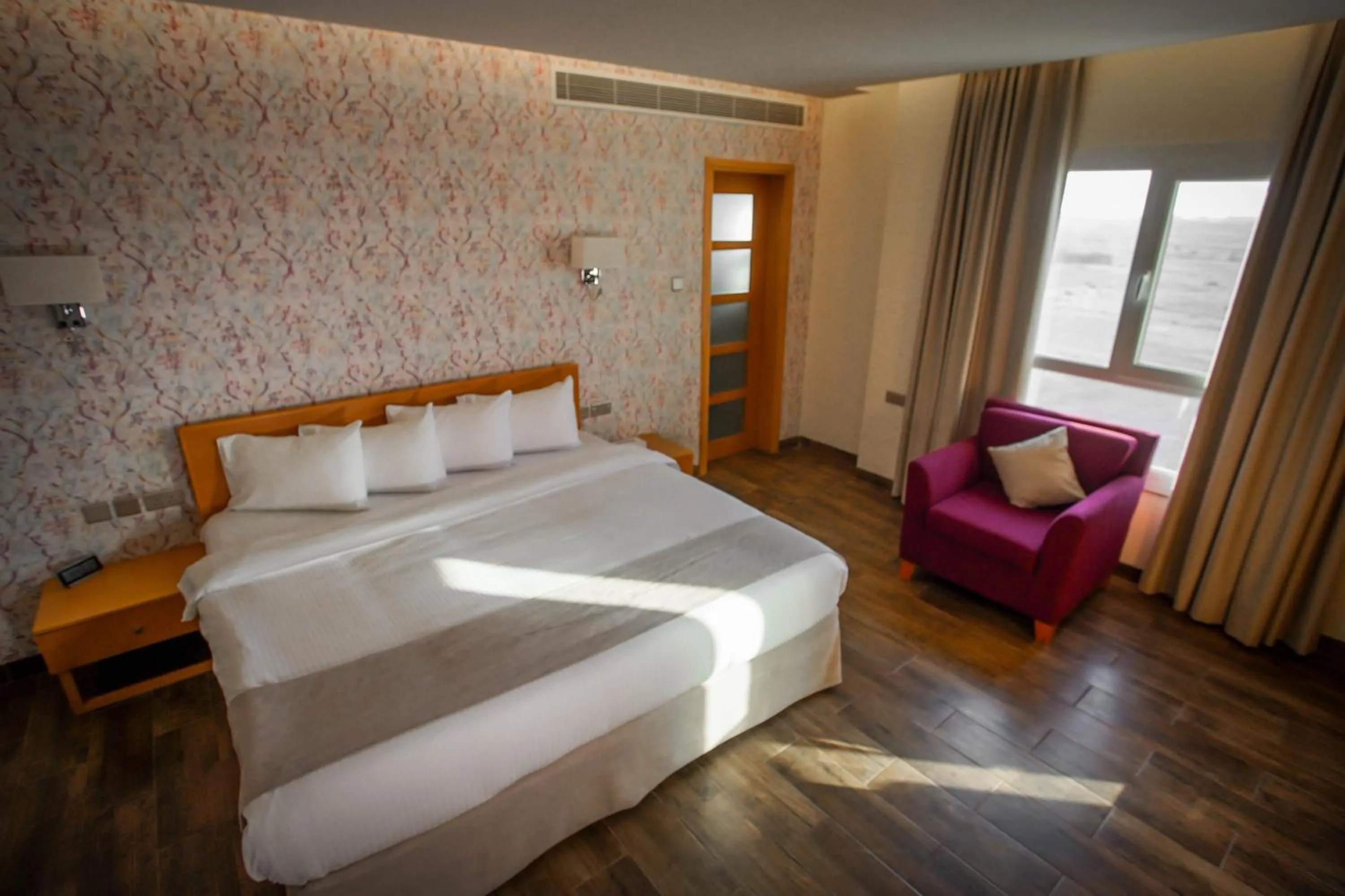 Bed in Sama Muscat Hotel