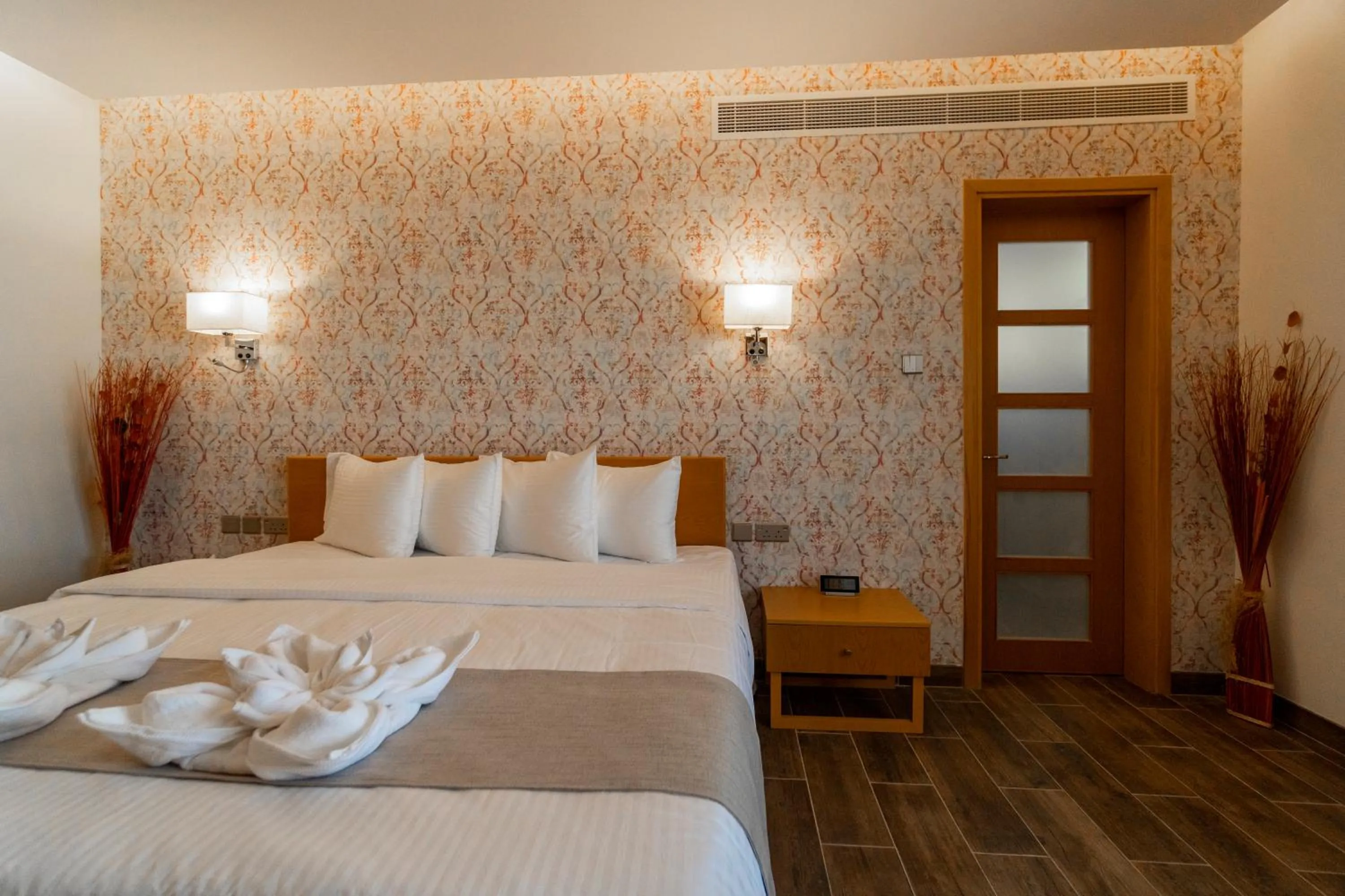 Bed in Sama Muscat Hotel