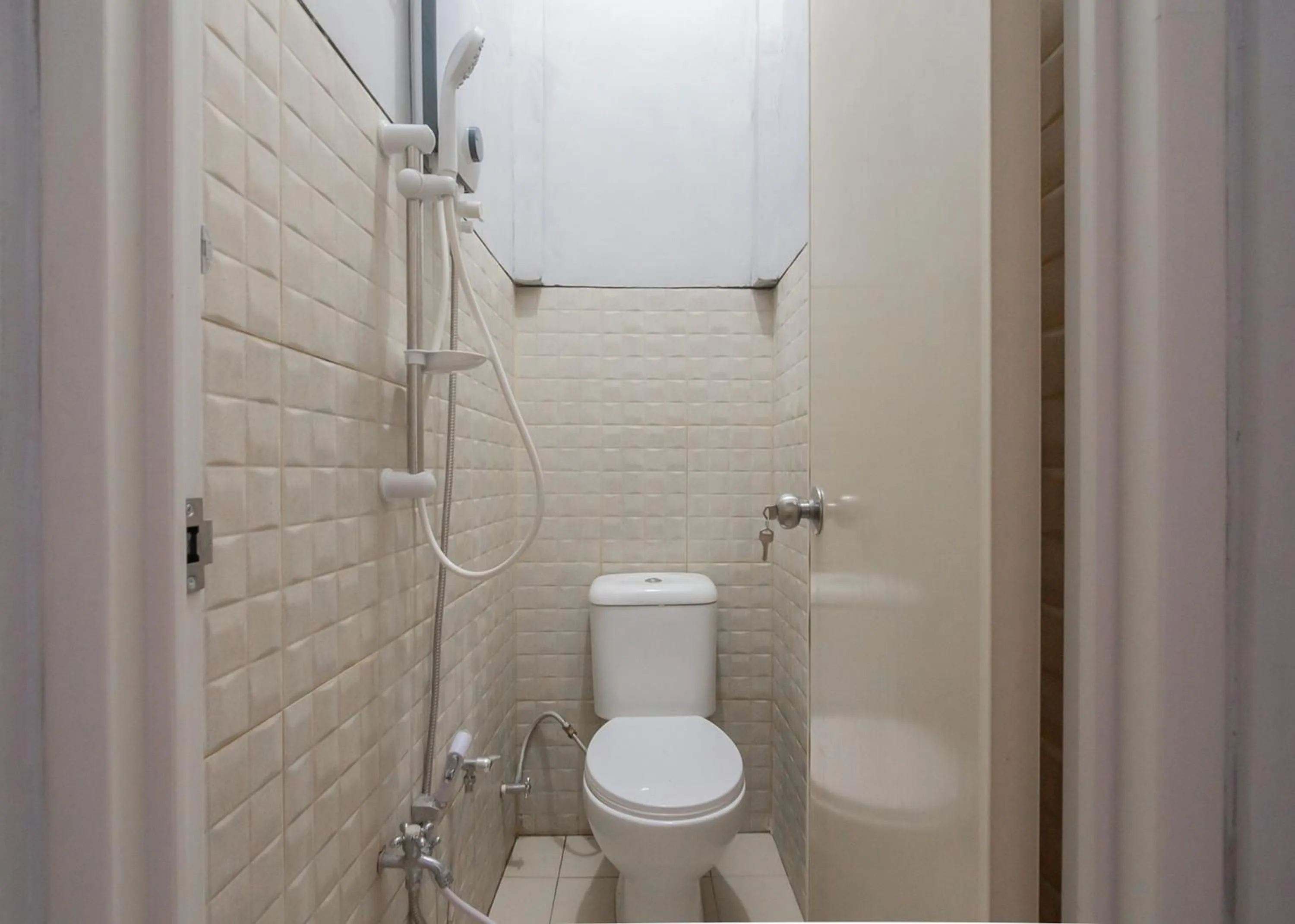 Bathroom in RedDoorz Syariah near Wisata Situ Gunung Sukabumi