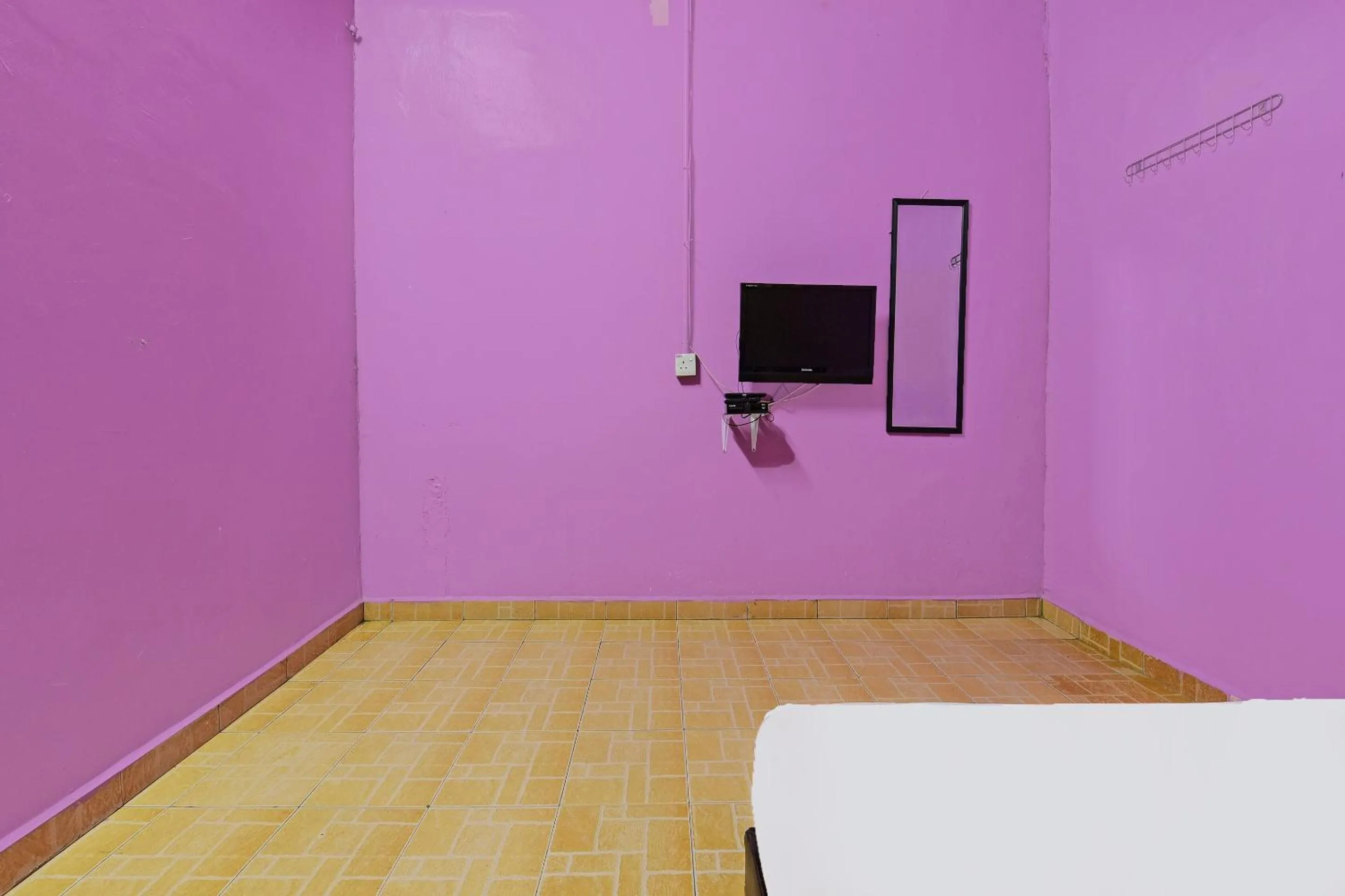 Bedroom in SPOT ON 90144 Corridor Hotel 1