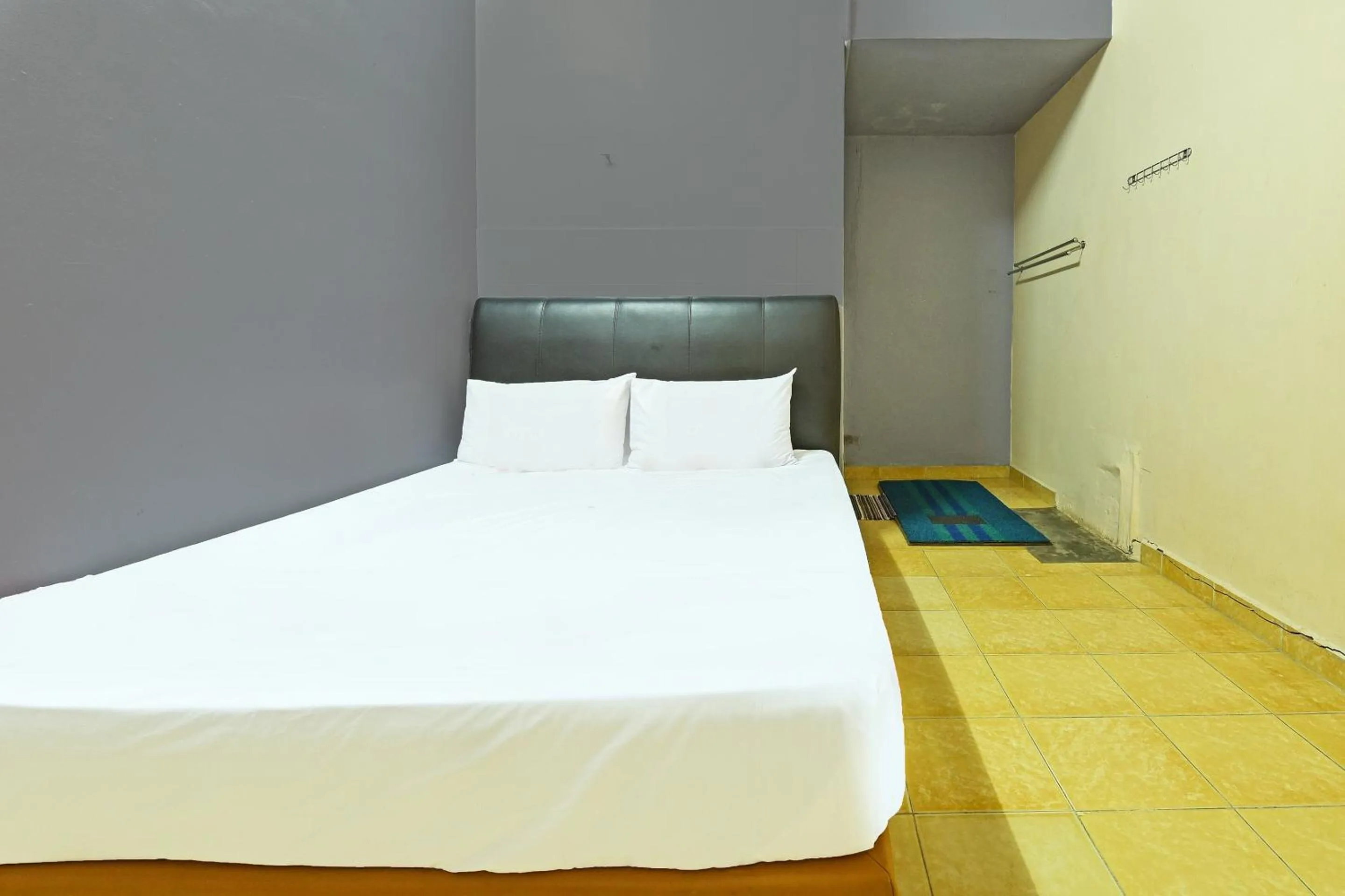 Bedroom in SPOT ON 90144 Corridor Hotel 1