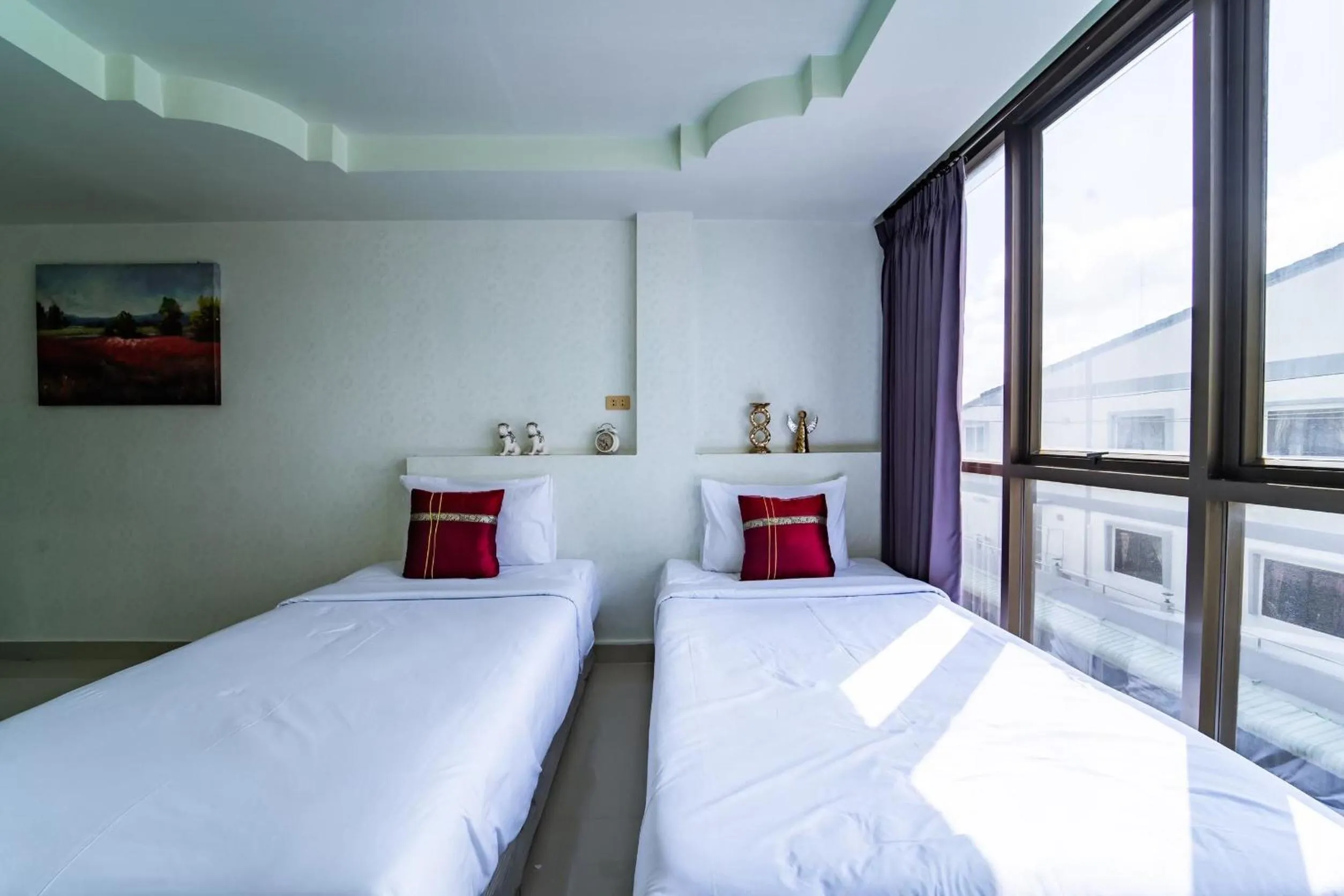 Bedroom in OYO 75377 Check In House