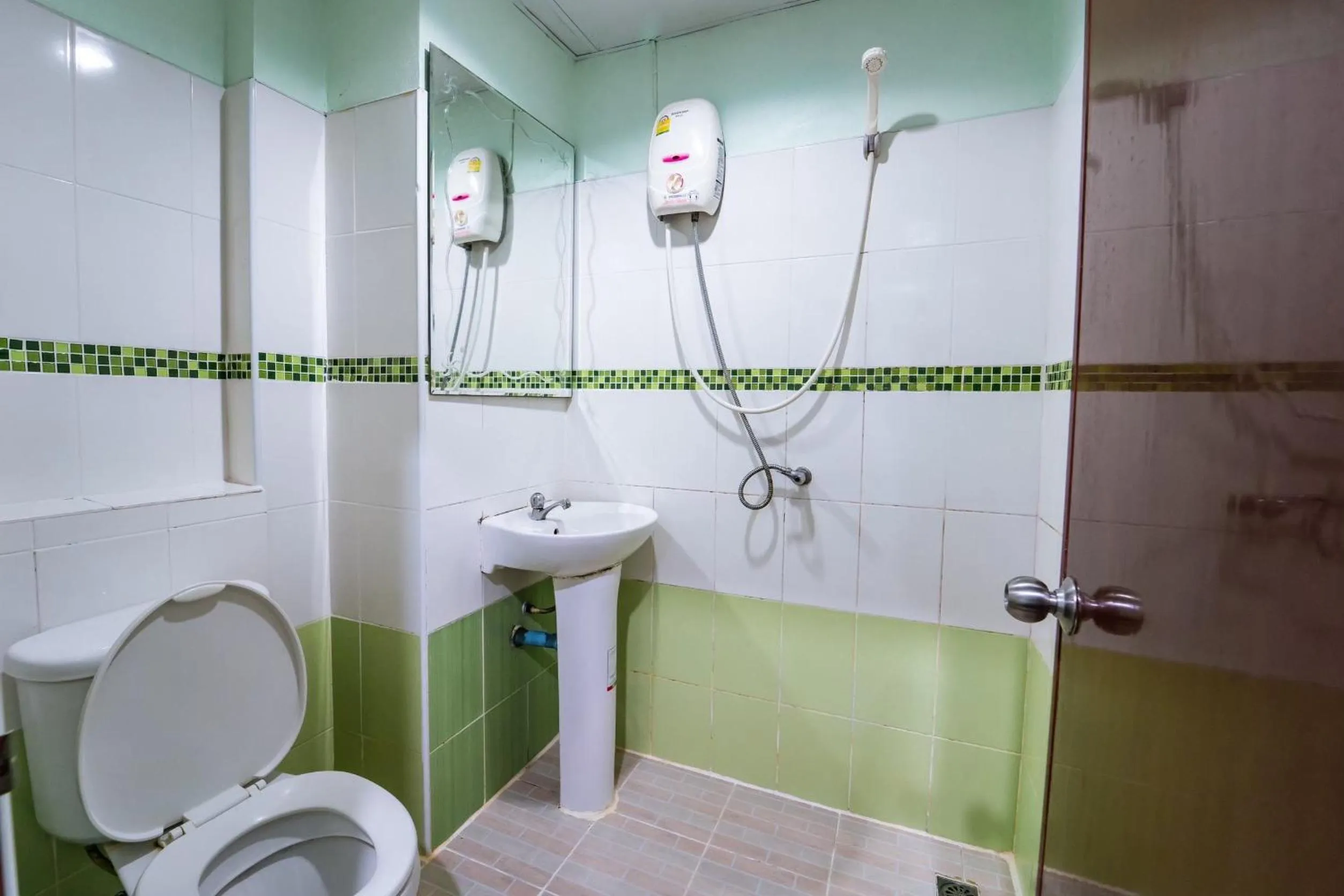 Bathroom in OYO 75377 Check In House