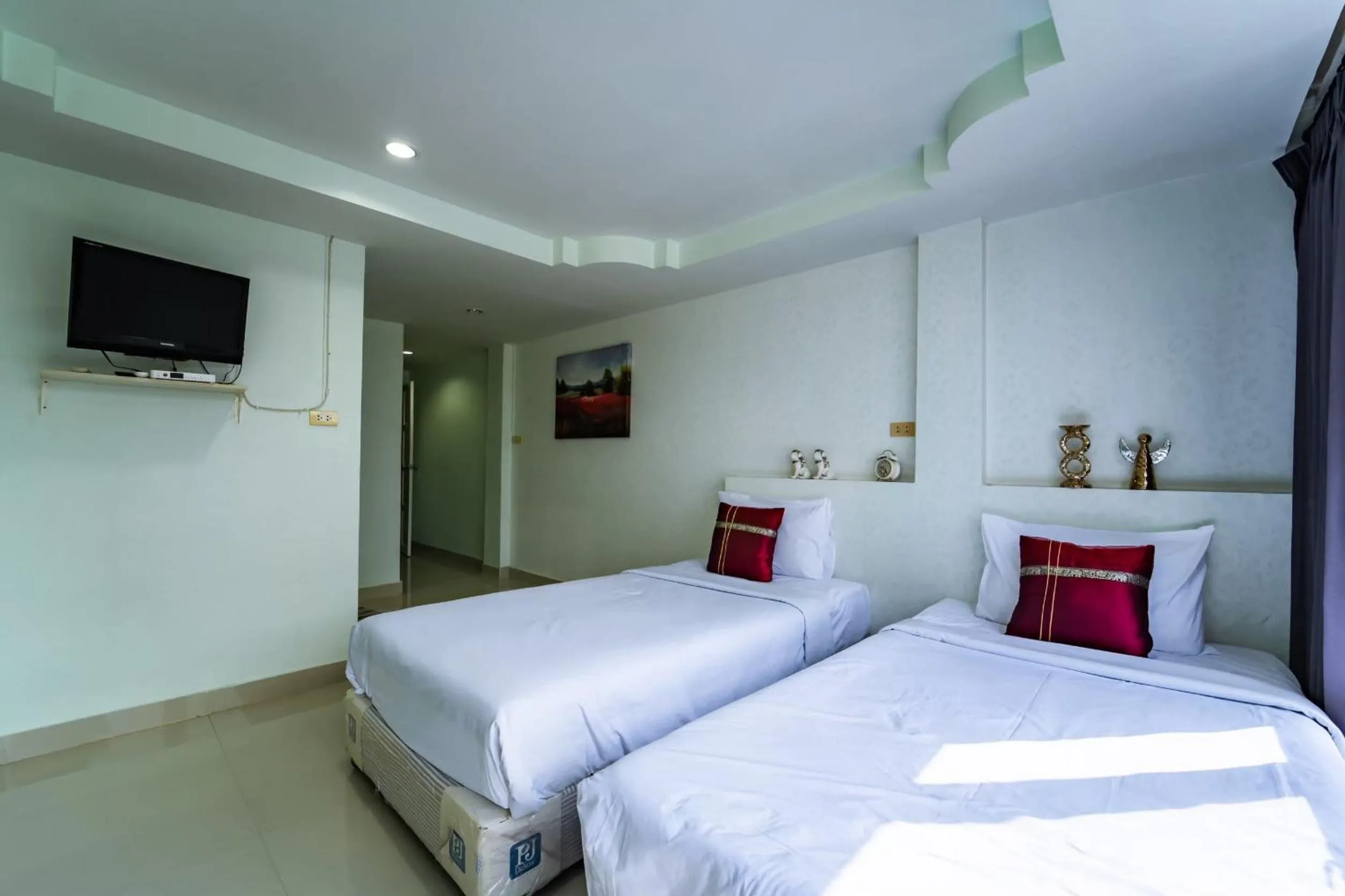 Bedroom in OYO 75377 Check In House