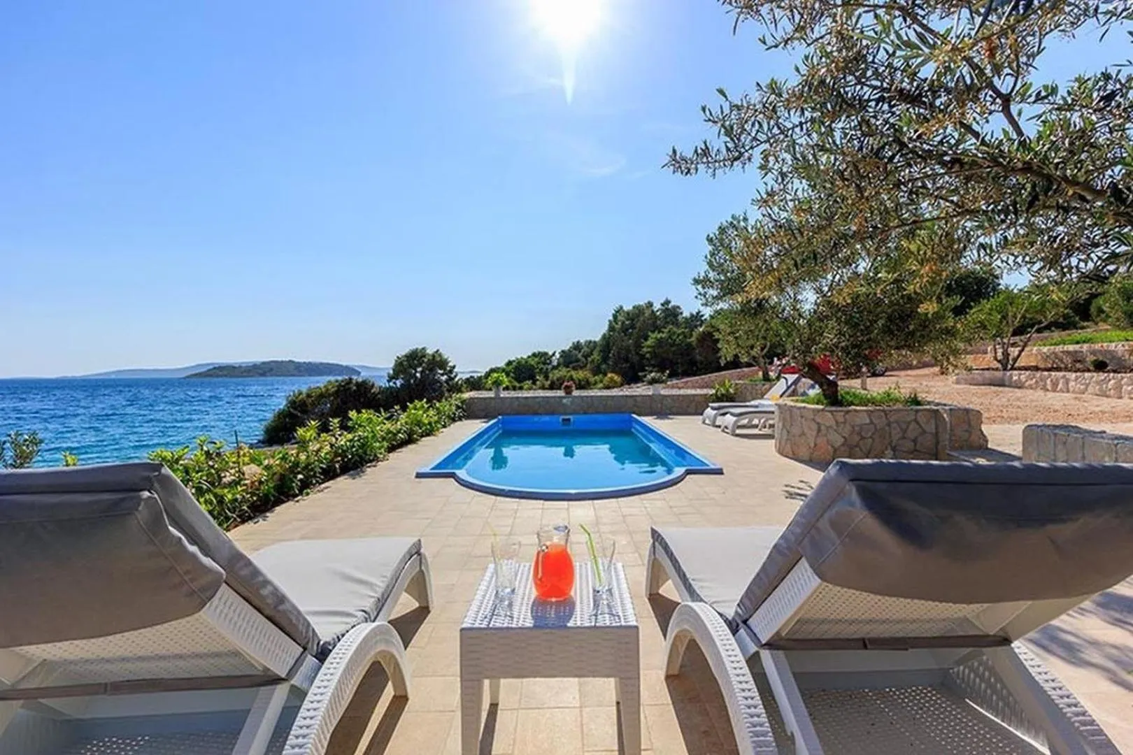 Property building in Luxury Beachfront Villa Dalmatino Trogir with private pool right at the beach in Okrug Gornji - Ciovo