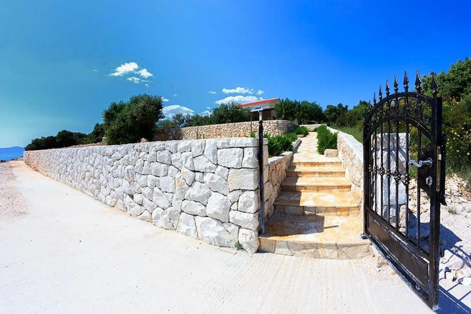 Property building in Luxury Beachfront Villa Dalmatino Trogir with private pool right at the beach in Okrug Gornji - Ciovo