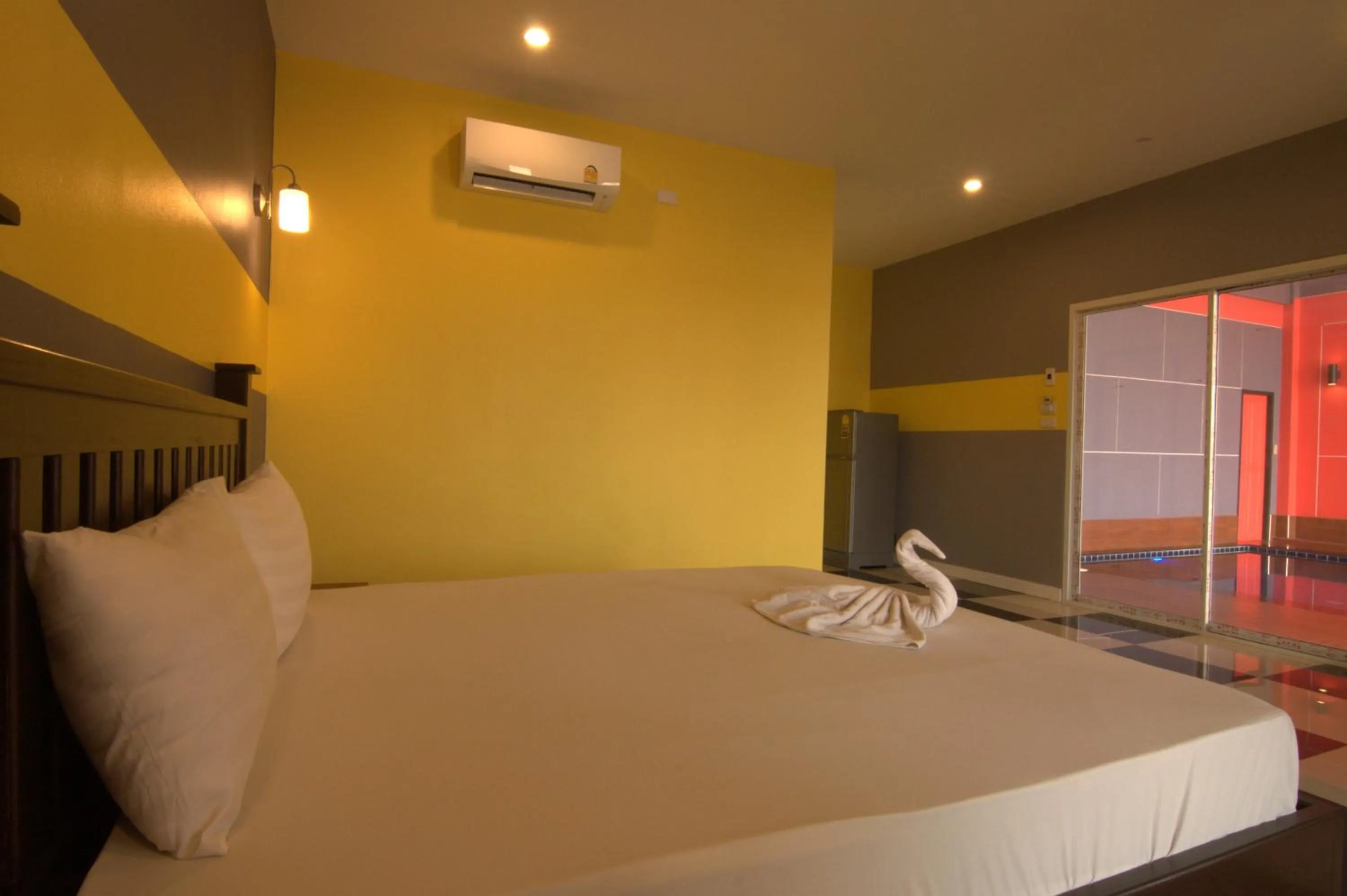 Bed in The Palm Resort Kampeang Saen