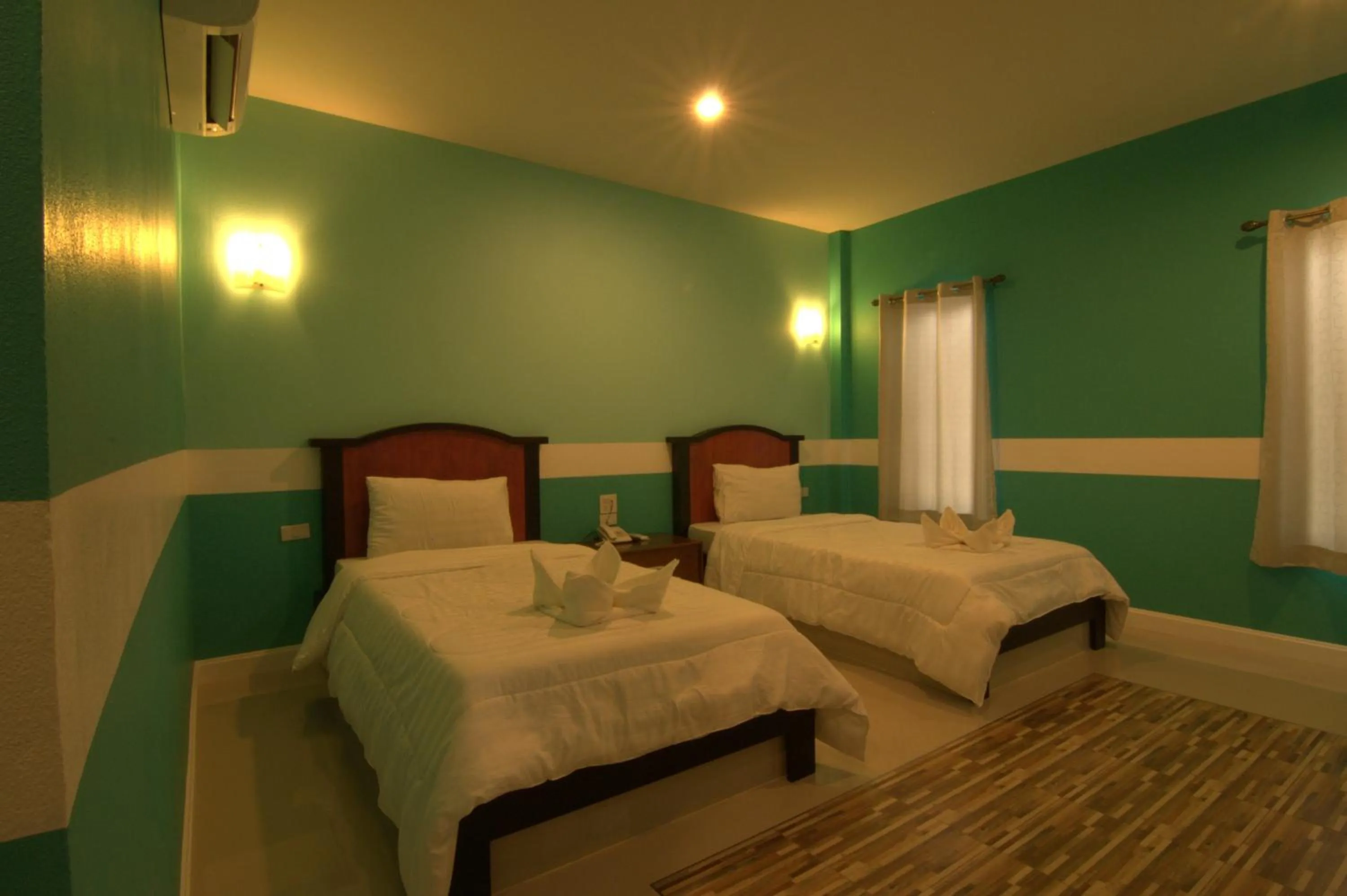 Bed in The Palm Resort Kampeang Saen