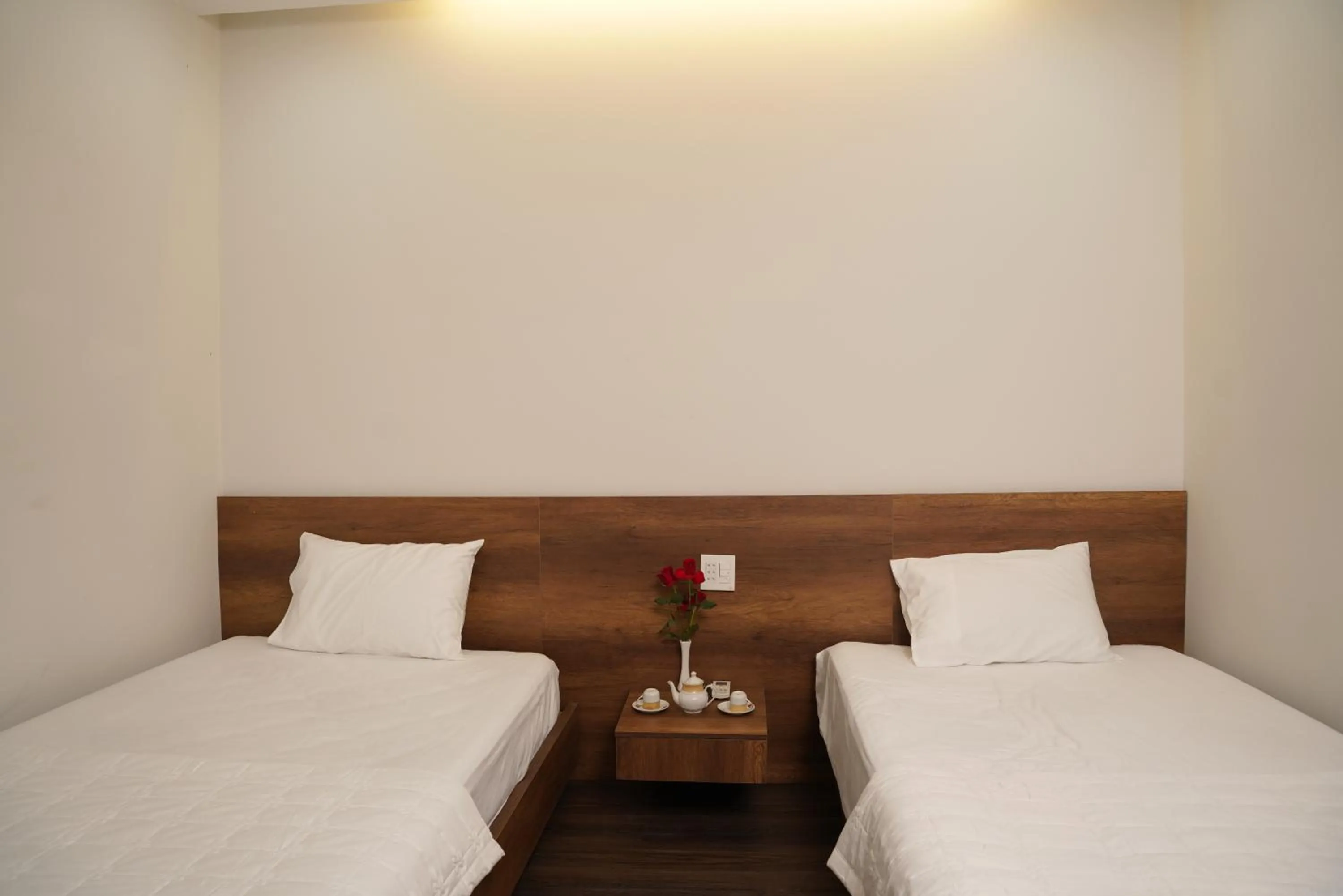 Bed in KHÁCH SẠN ĐẾ VƯƠNG