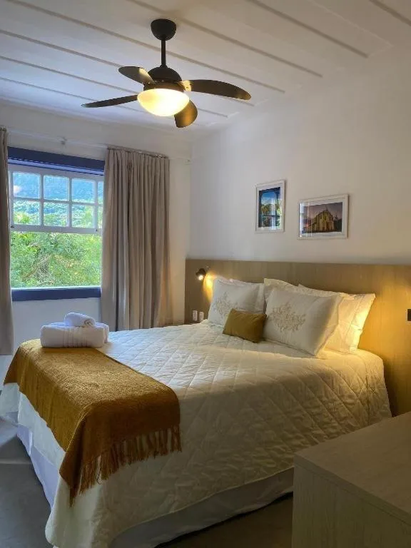 Bed in Pousada Relicário