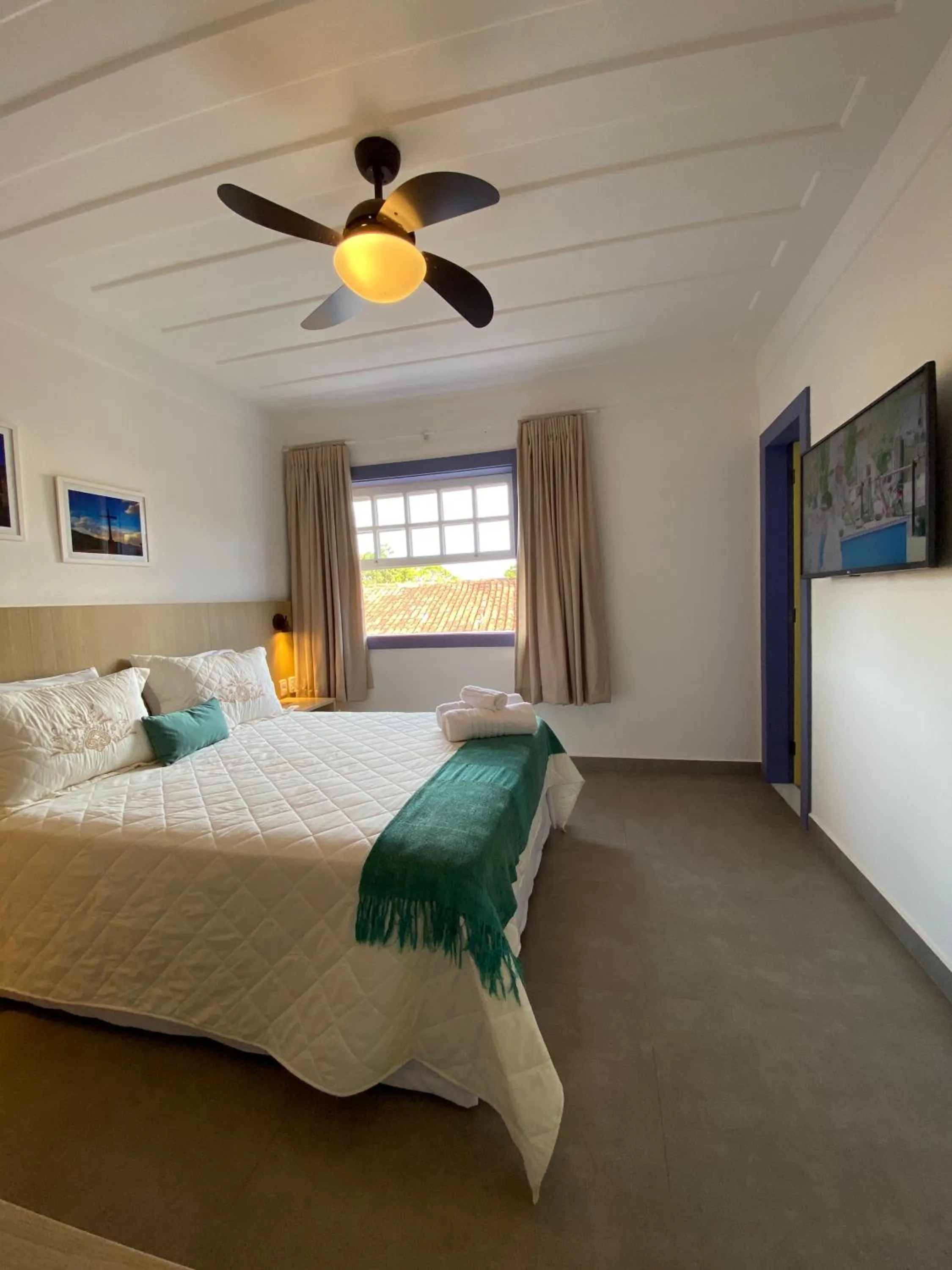 Bed in Pousada Relicário