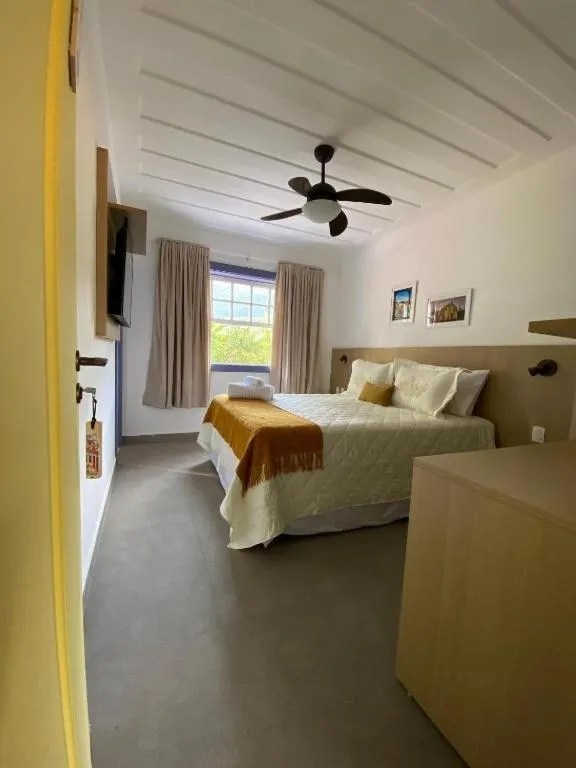 Bed in Pousada Relicário