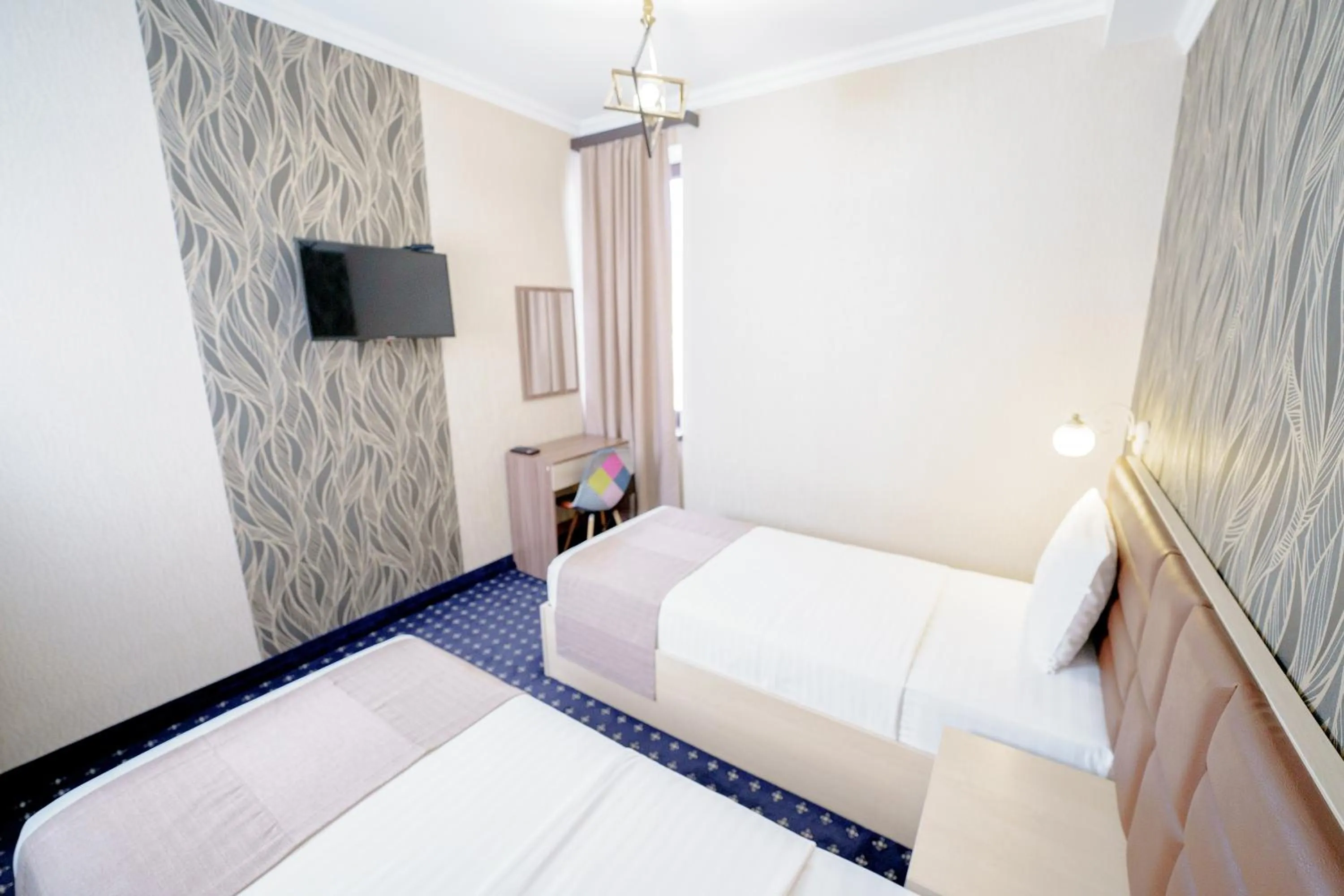 Bed in Welcome Inn Hotel