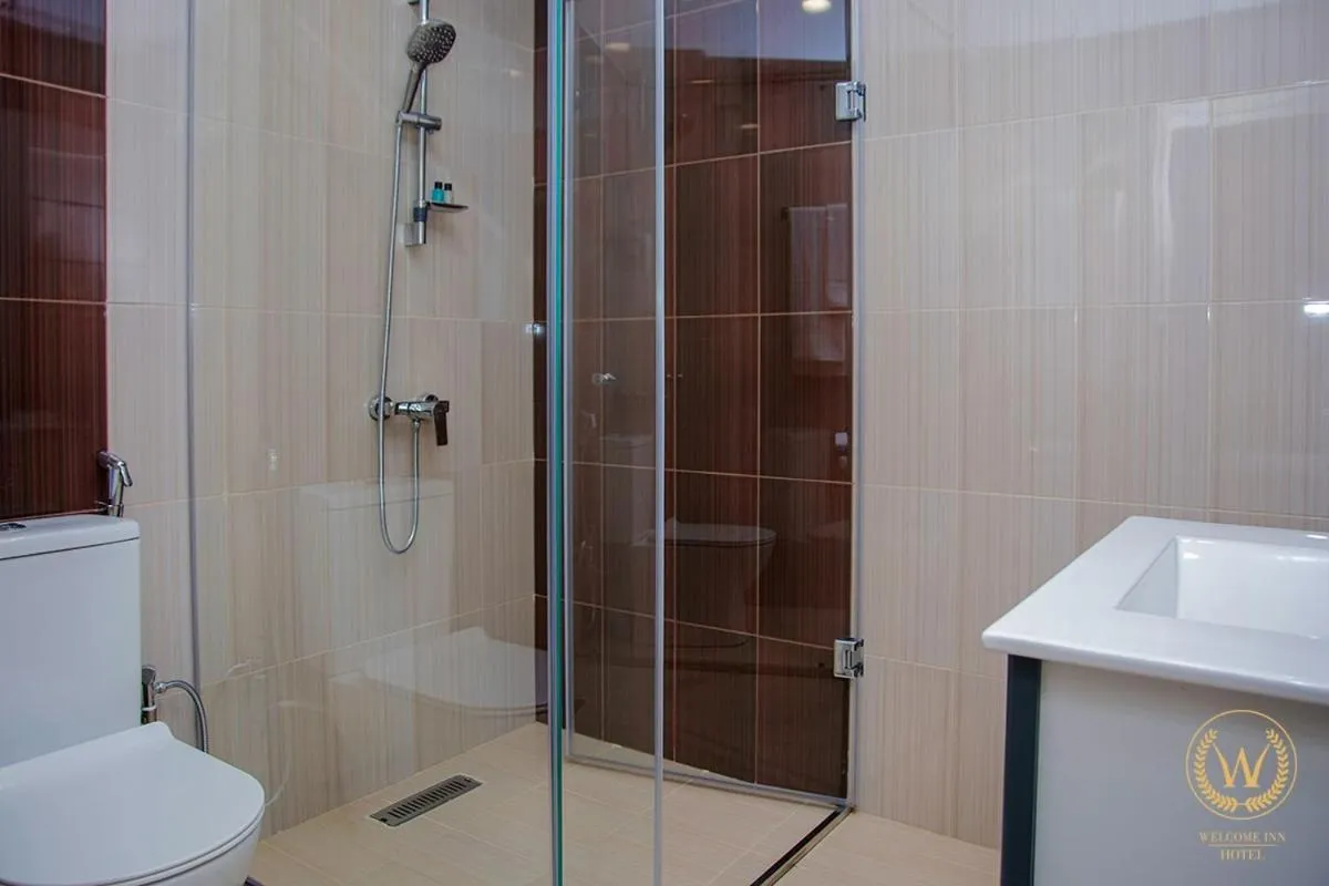 Shower in Welcome Inn Hotel