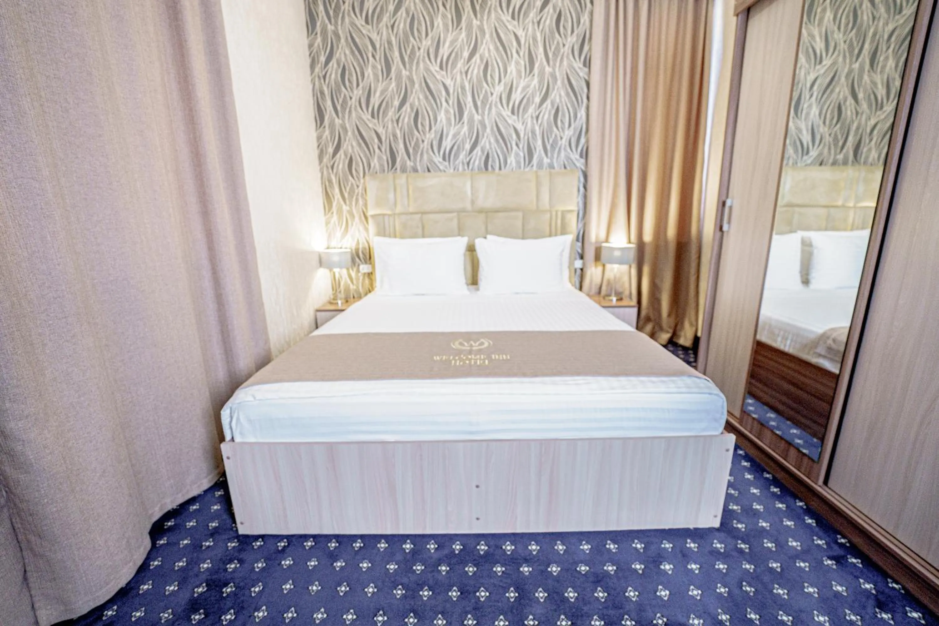 Bed in Welcome Inn Hotel