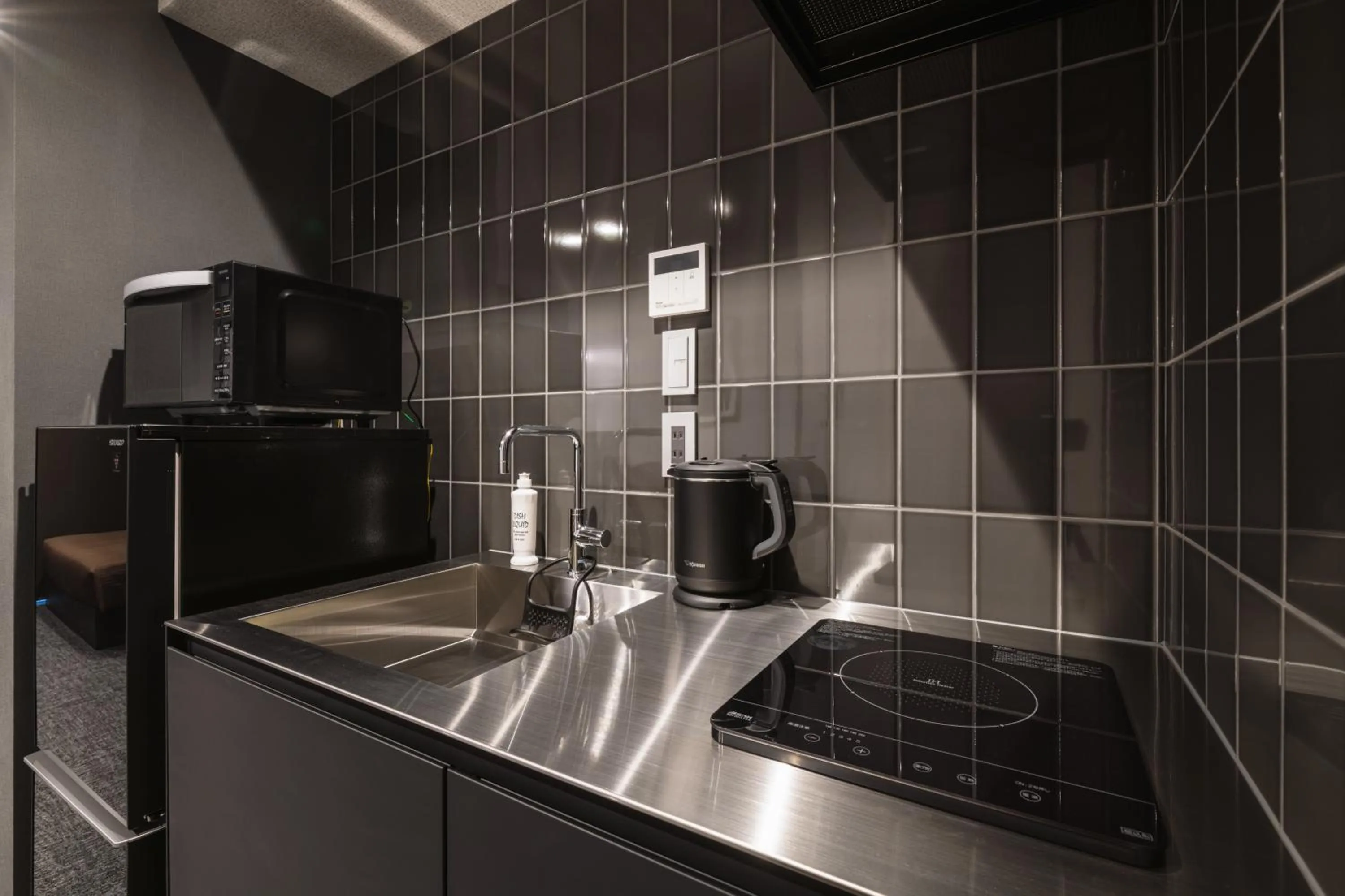 Kitchen or kitchenette in GRAND BASE Hakata Premium