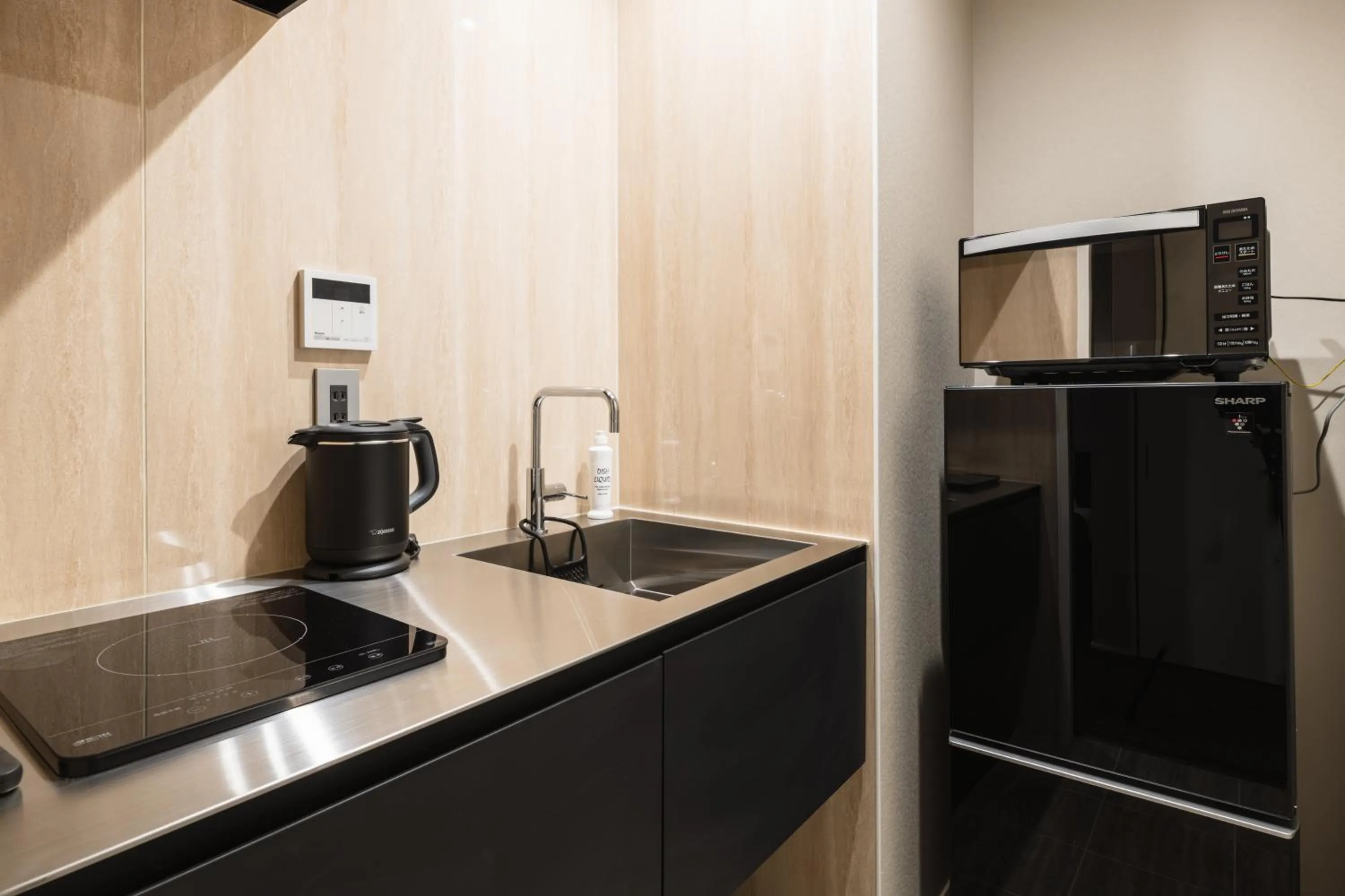 Kitchen or kitchenette in GRAND BASE Hakata Premium