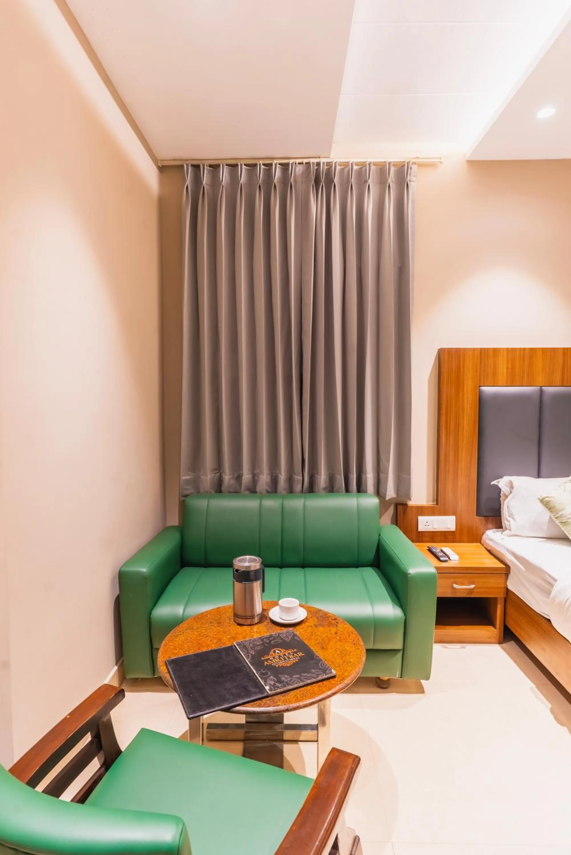 Seating area, Bed in Hotel Amritsar International 2 min walk from Amritsar Bus Stand