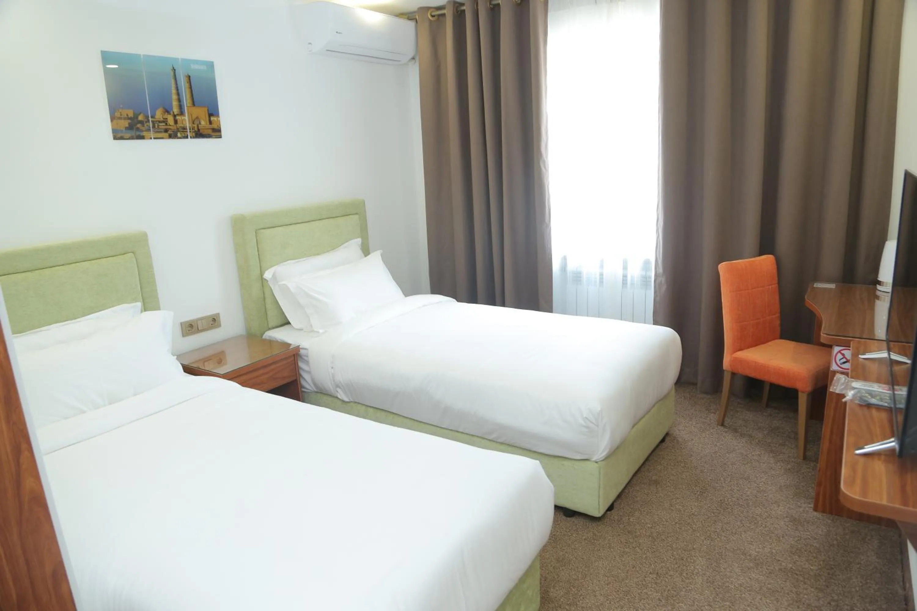 Bed in Sunrise Hotel