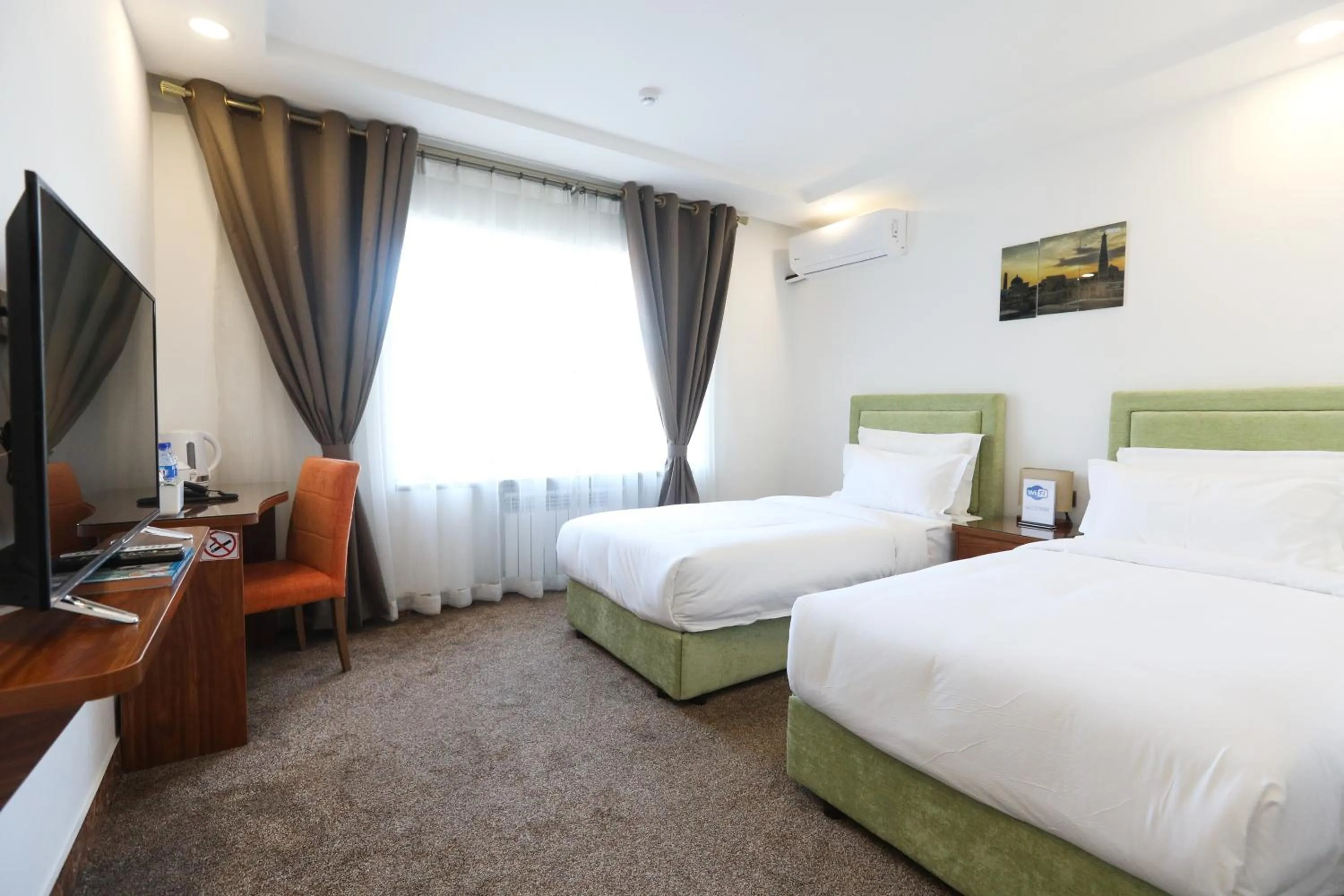 Bed in Sunrise Hotel