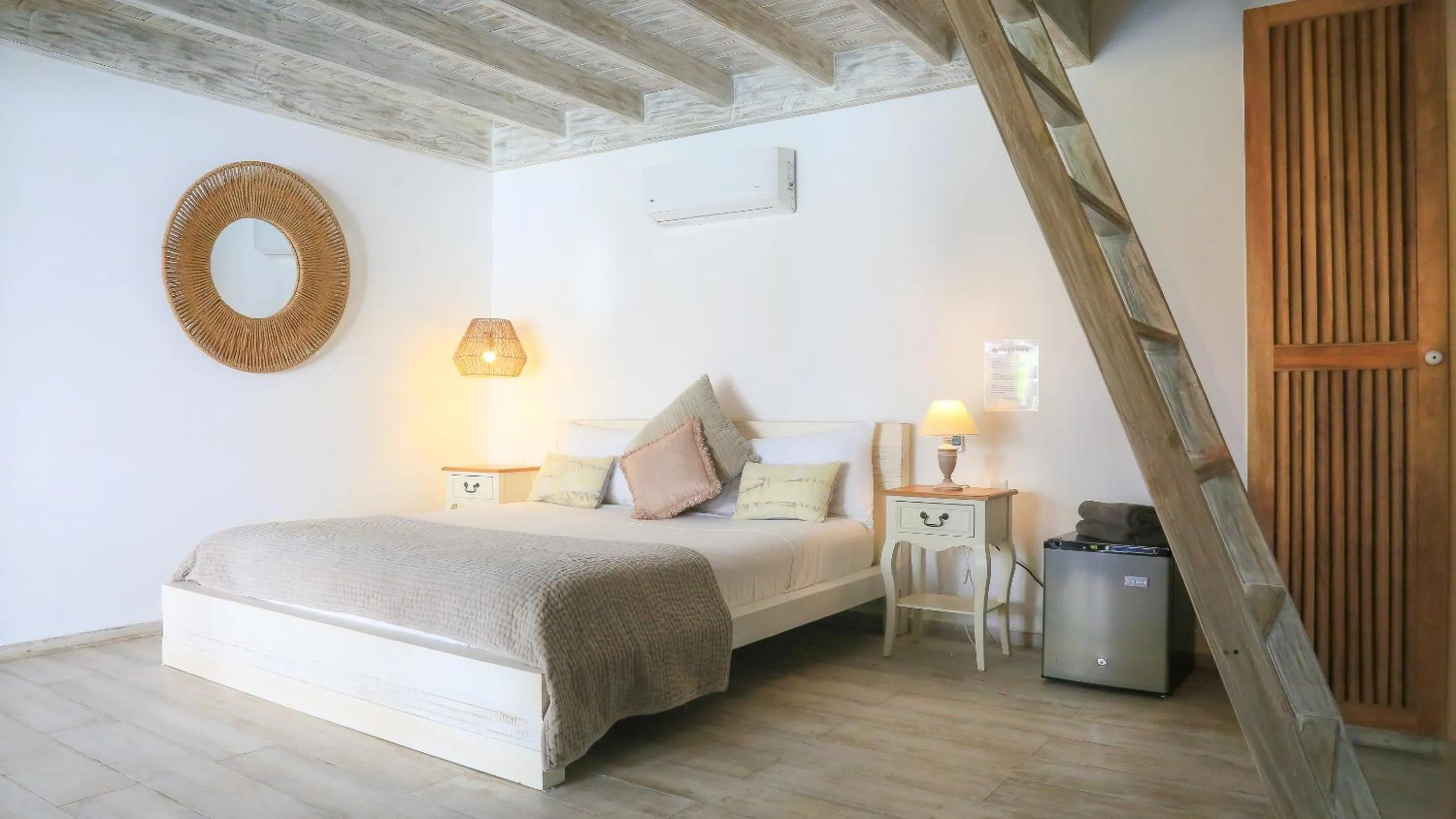 Bed in TAKUMA BOUTIK HOTEL