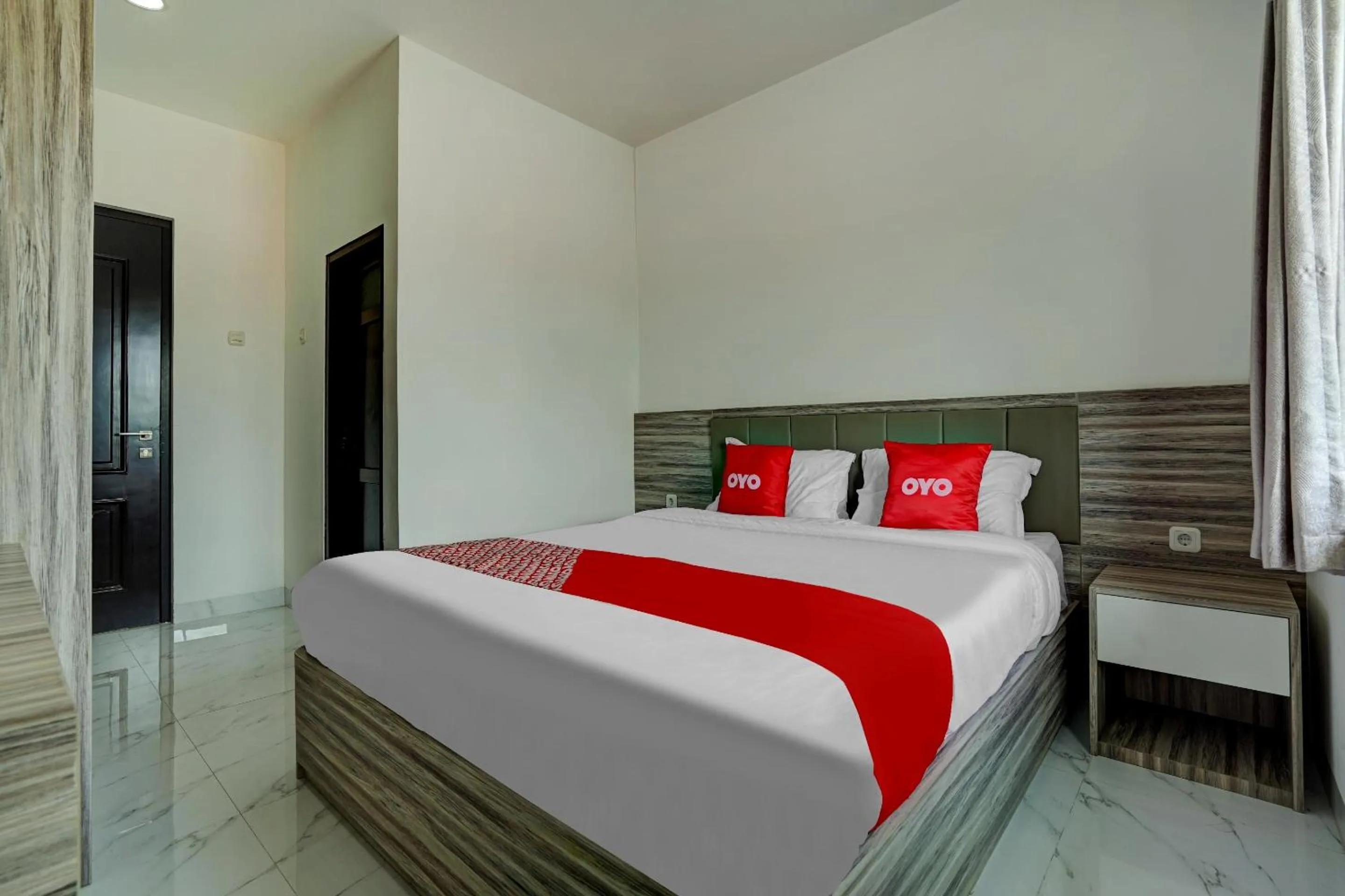 Bedroom in OYO Capital O 90164 La'rissa Residence