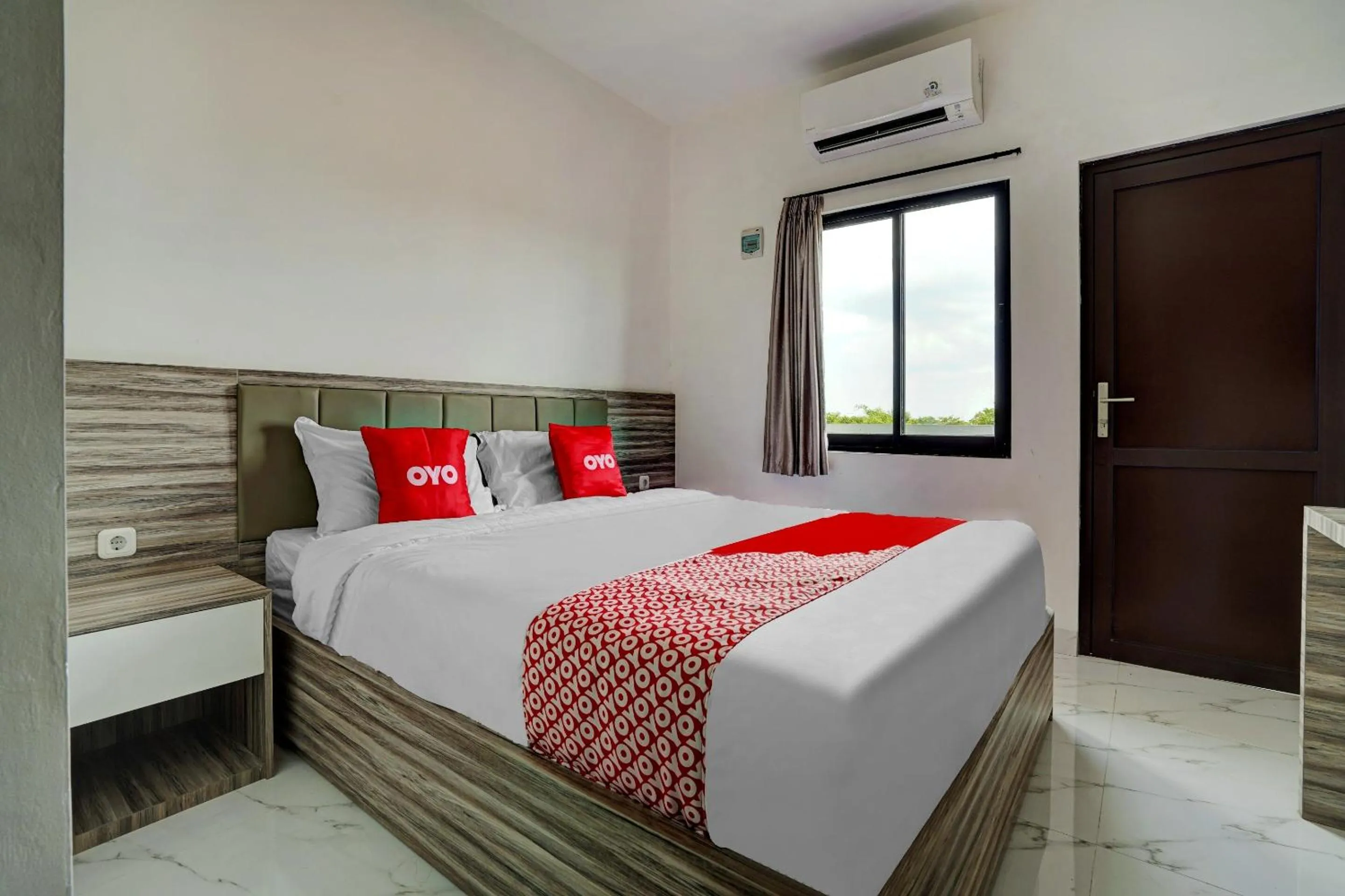 Bedroom in OYO Capital O 90164 La'rissa Residence