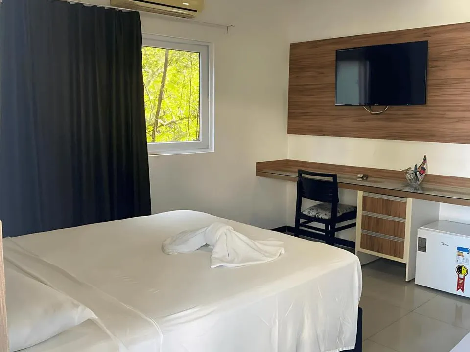 Bed in Pousada Jirituba