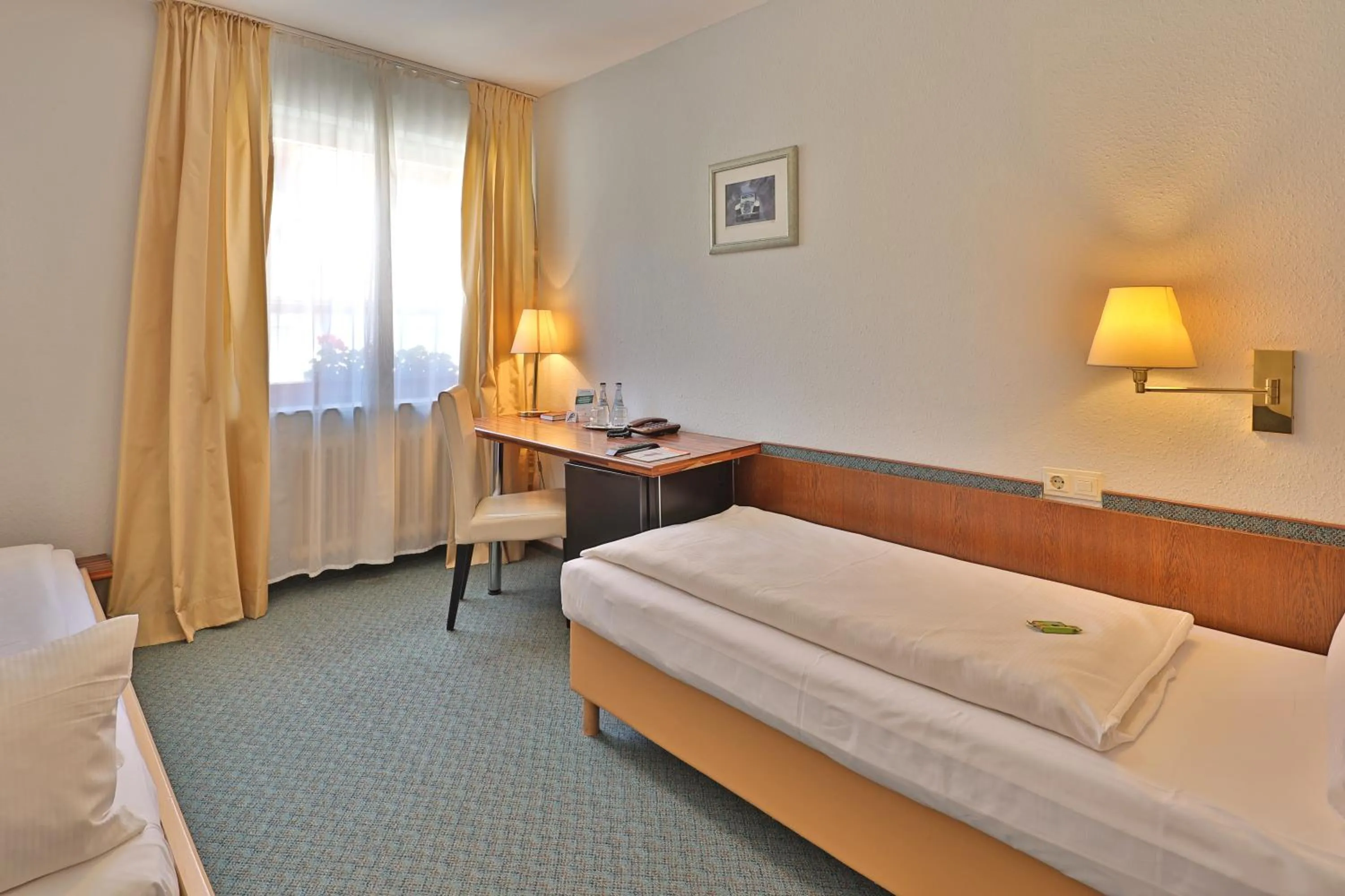 Bed in Aparthotel Deutschmeister