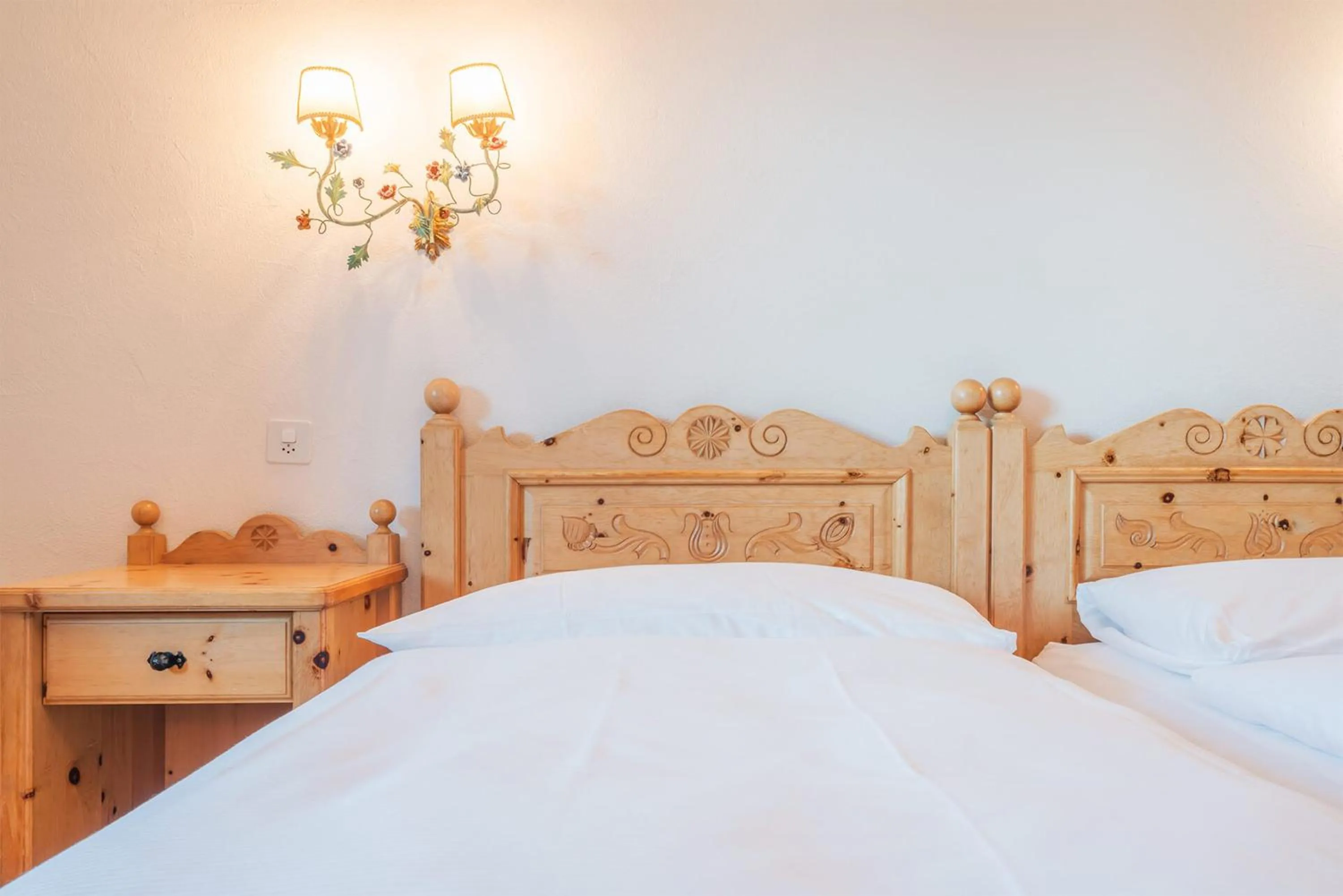 Bed in Hotel Corvatsch - Web Check-in