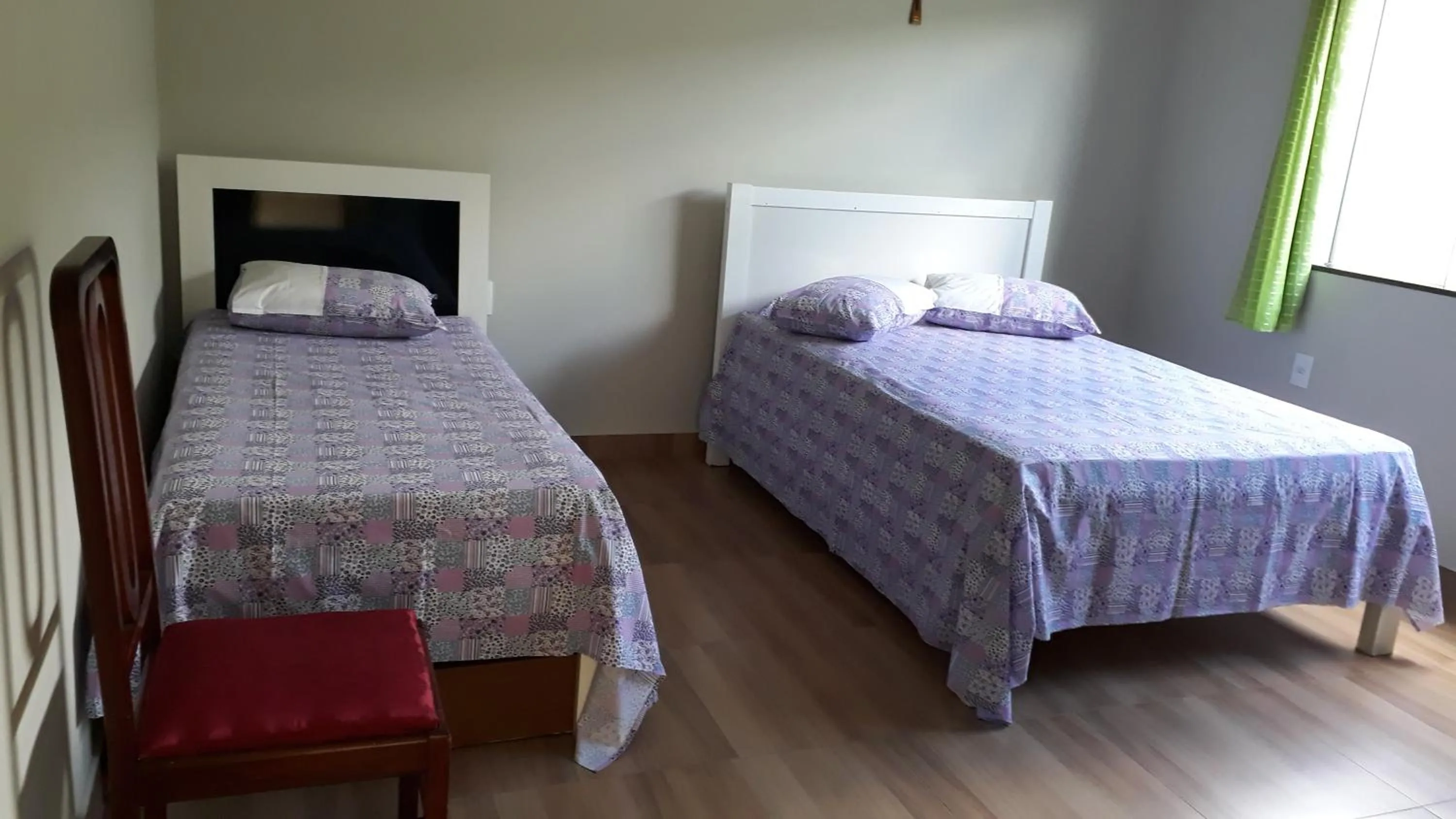 Bed in Pousada Pérola Mineira