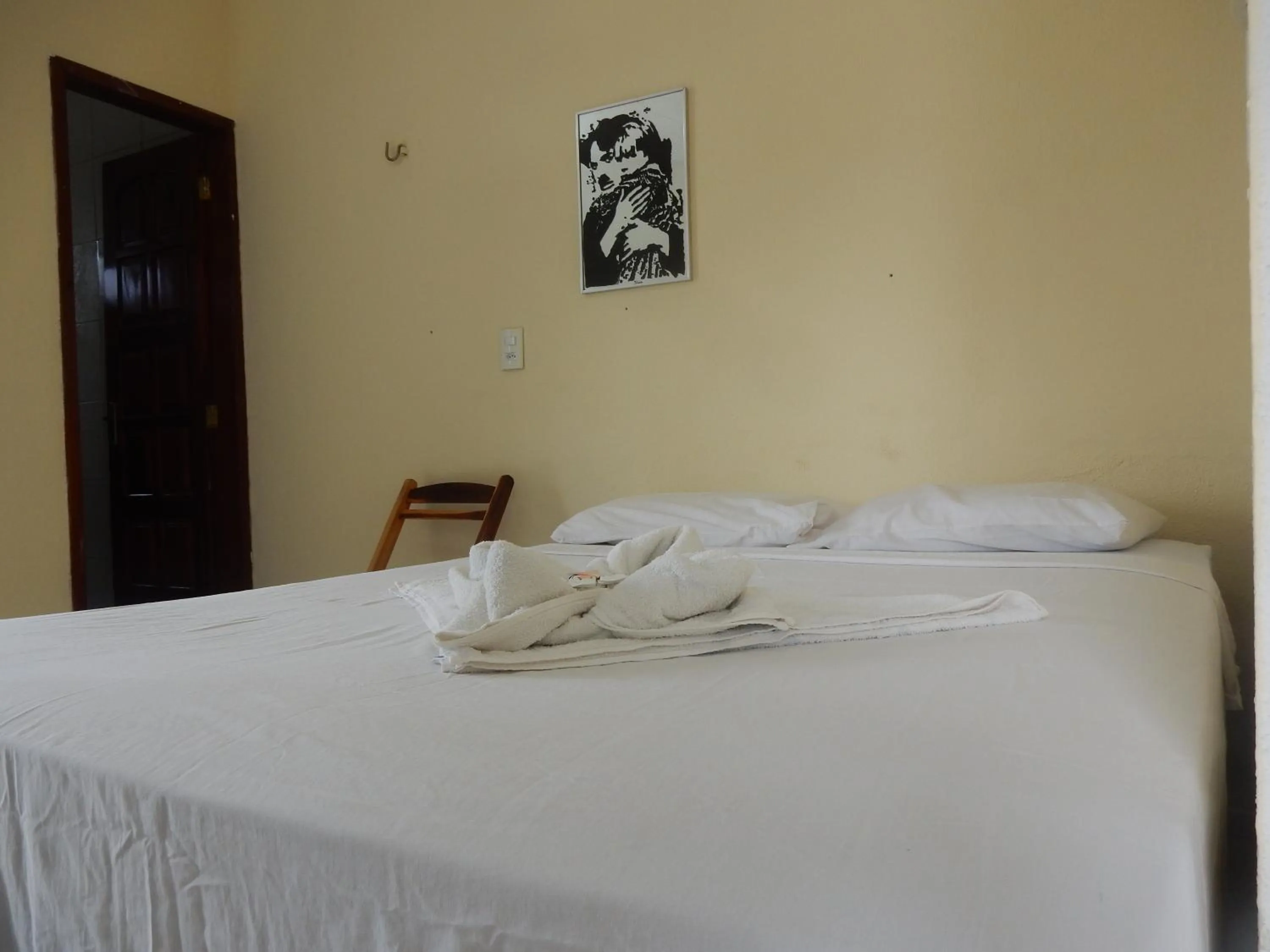Bed in Pousada Brisa da Canoa