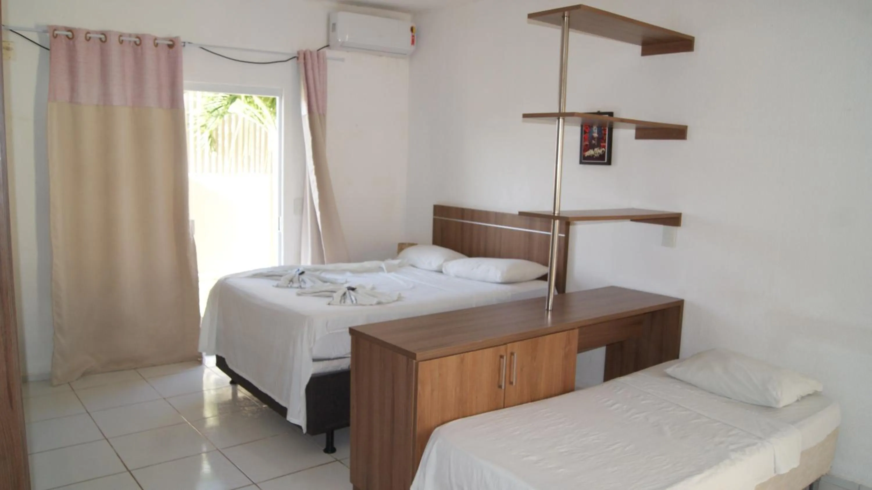Bed in Pousada Brisa da Canoa