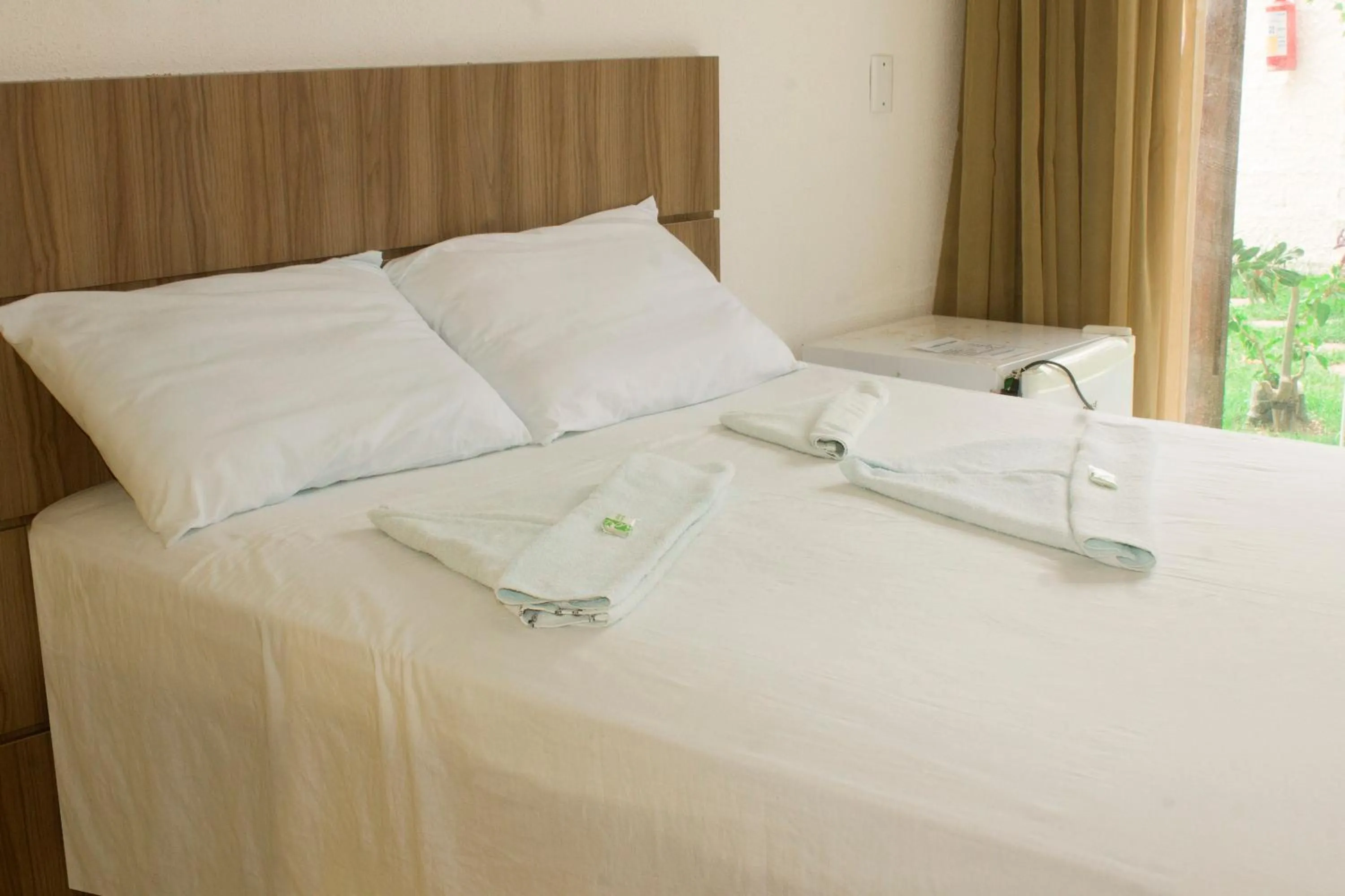 Bed in Pousada Brisa da Canoa