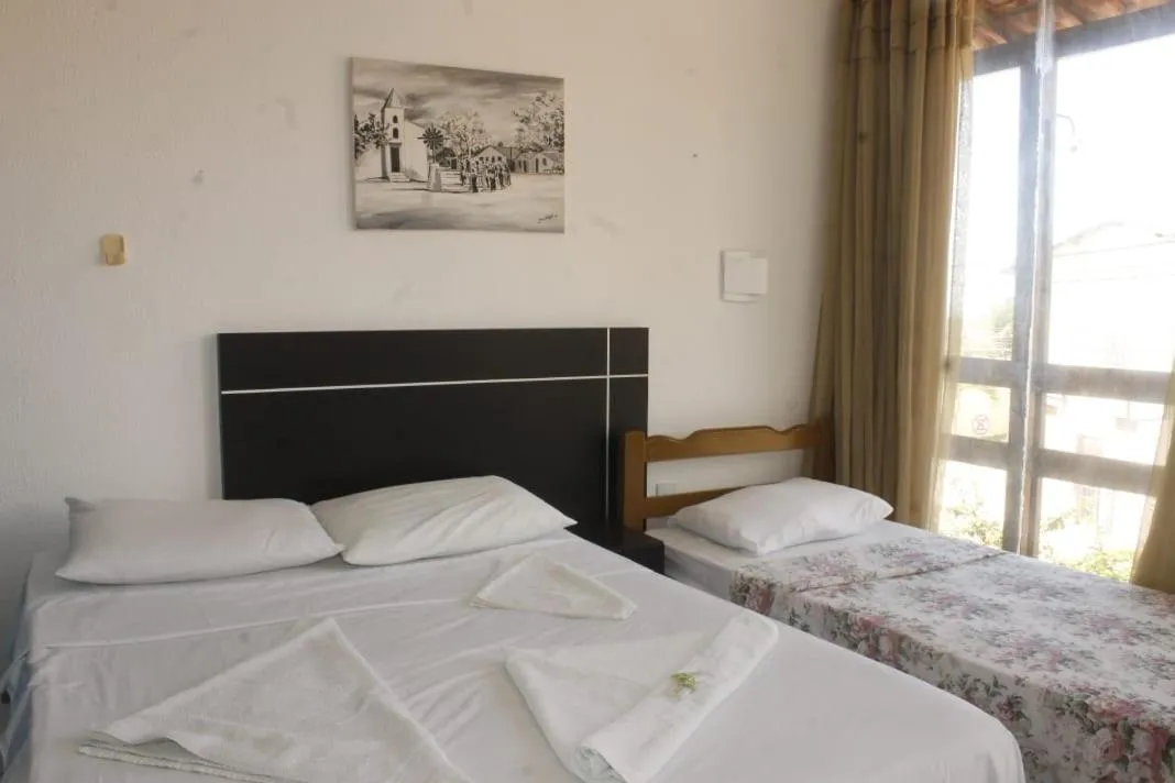 Bed in Pousada Brisa da Canoa