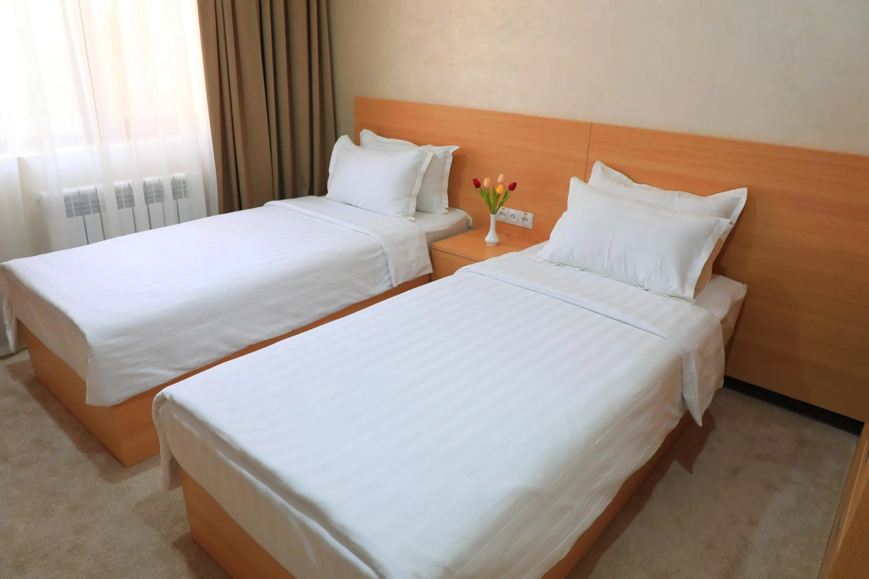 Bed in City INN Hotel