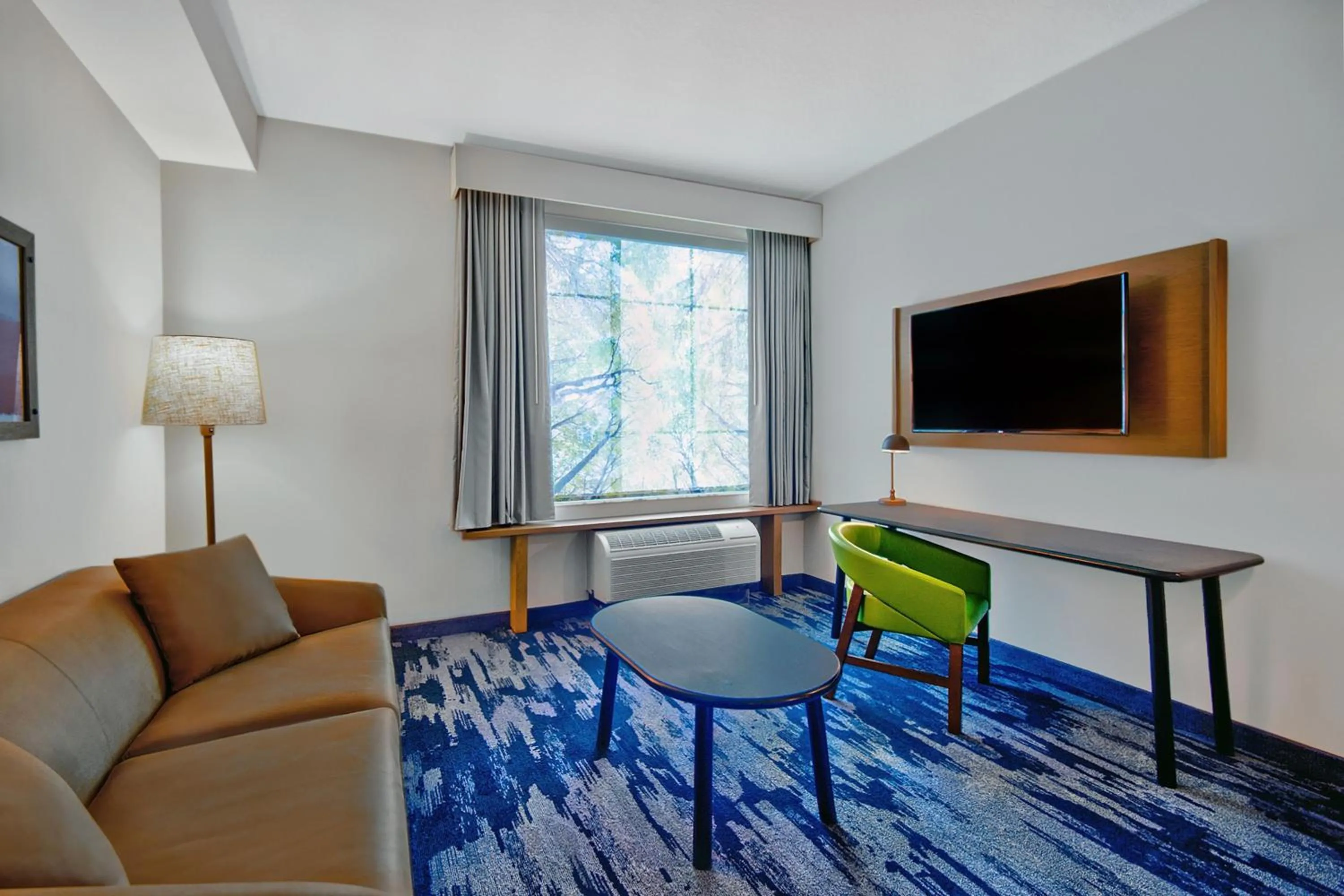 Living room in Fairfield by Marriott Inn & Suites Orlando at FLAMINGO CROSSINGS® Town Center