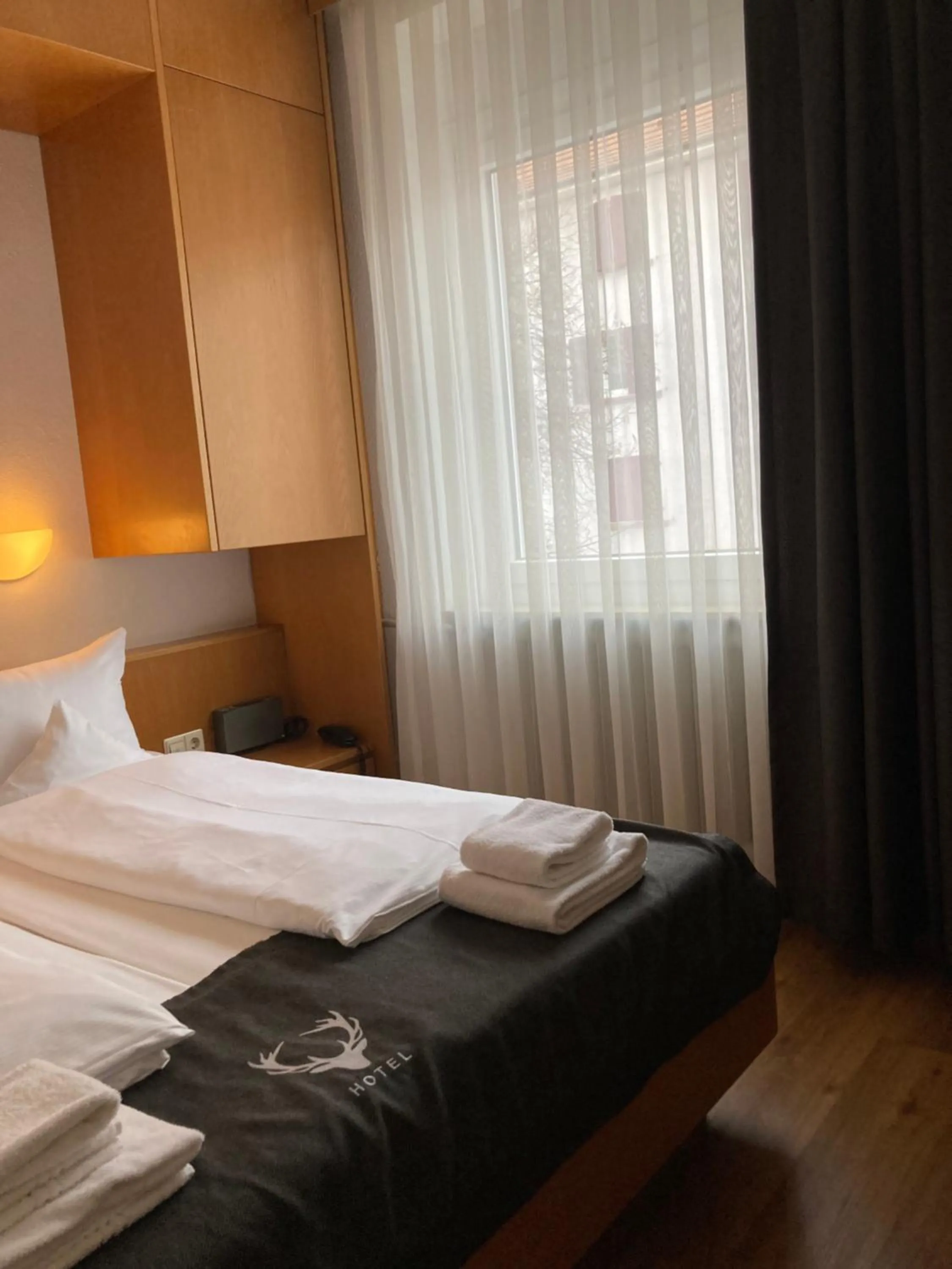 Photo of the whole room, Bed in Hotel JÄGERHAUS in Singen am Hohentwiel
