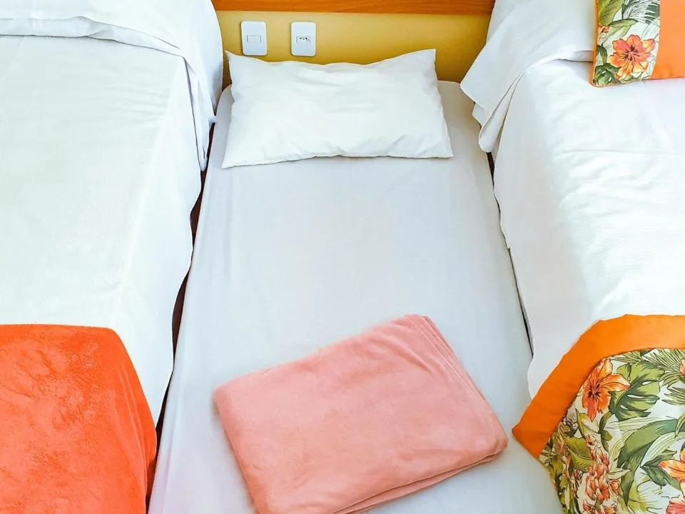 Bed in Pousada Cantinho da Praia