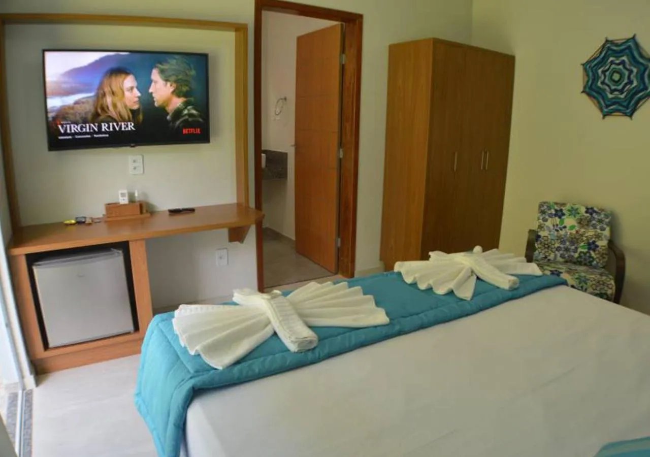 Communal lounge/ TV room, Bed in Pousada Cantinho da Praia