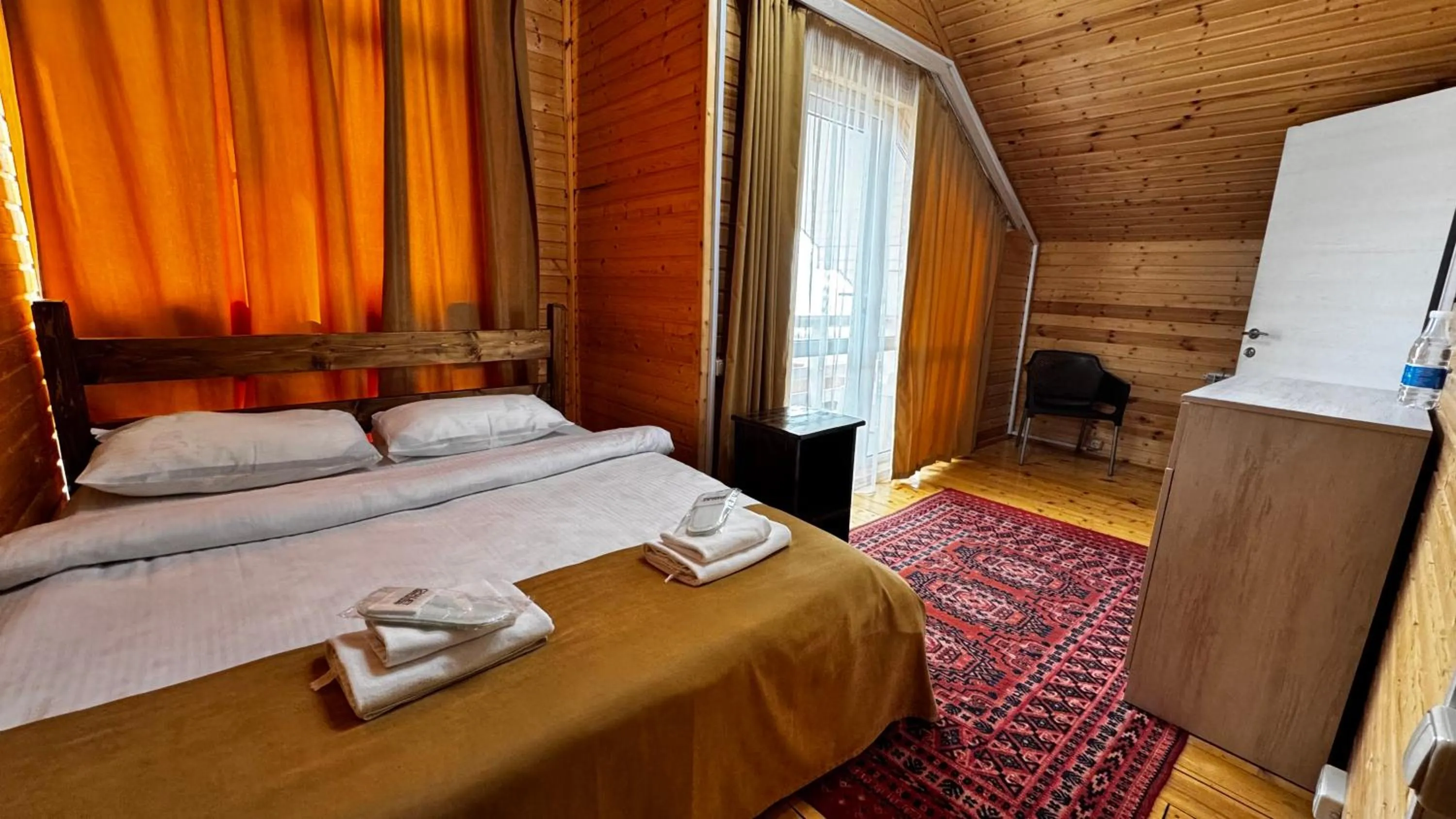Bed in COTTAGE CHALET and TOURS
