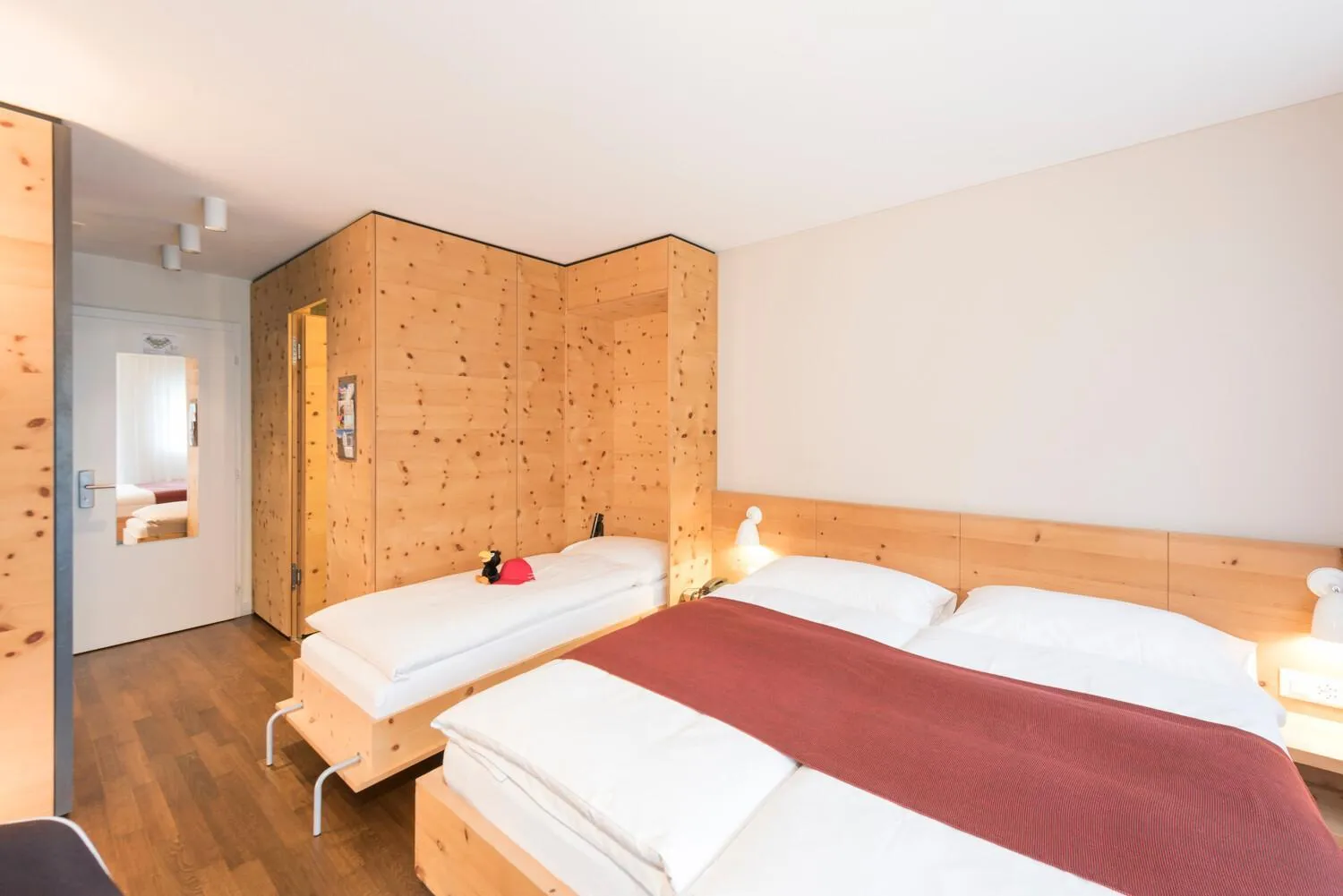 Bed in Hotel Schweizerhof Sils Maria, a Faern Collection Hotel