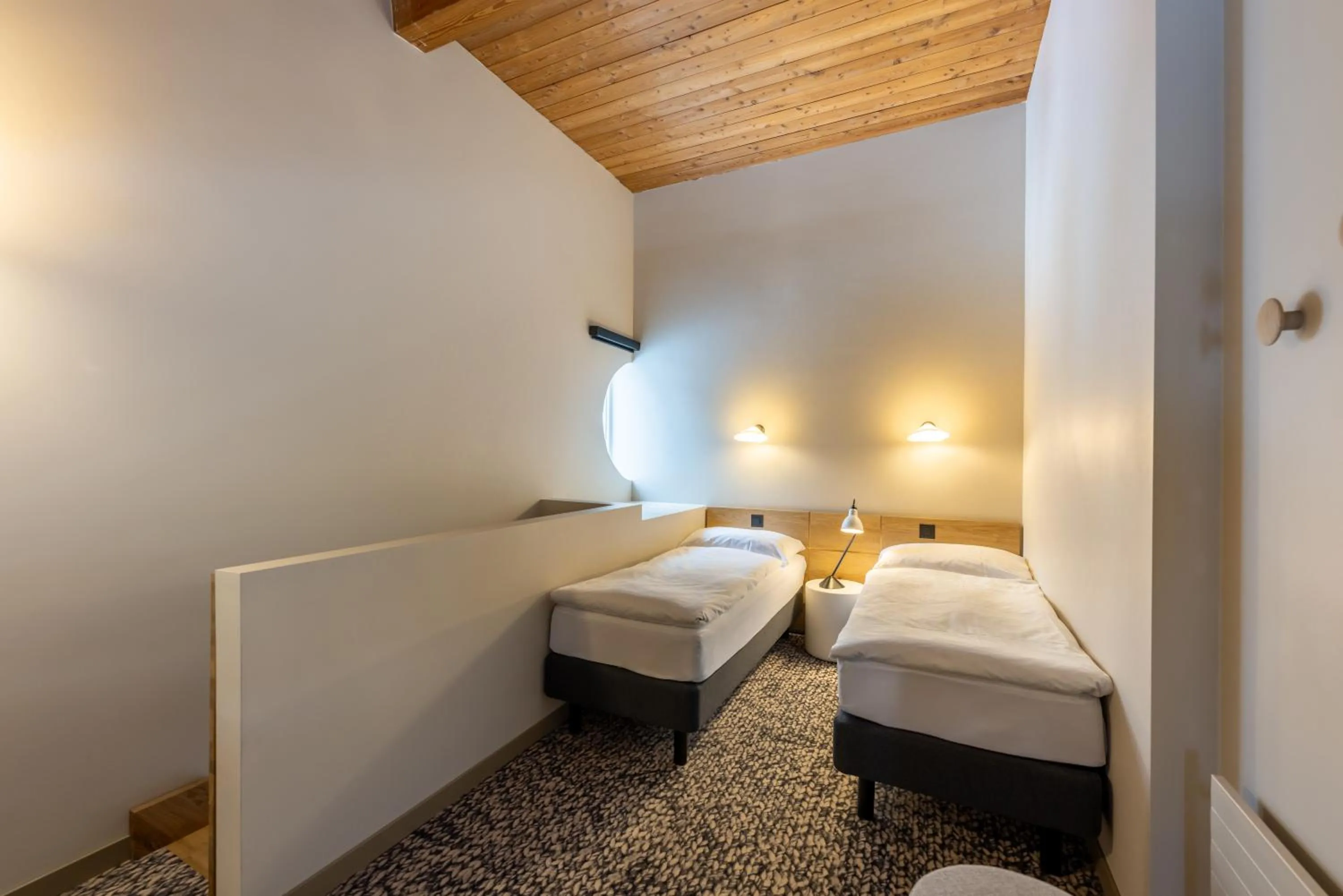 Bed in Hotel Schweizerhof Sils Maria, a Faern Collection Hotel