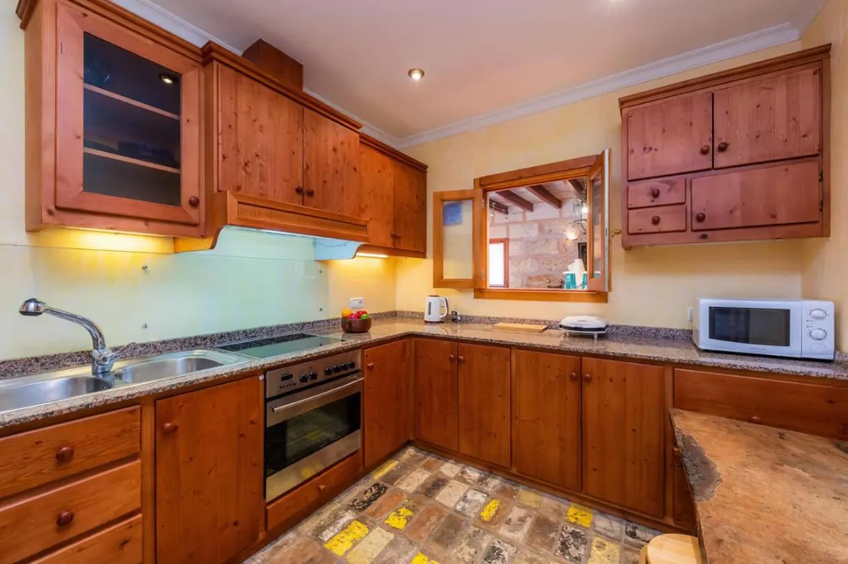 Kitchen or kitchenette in Es Revellar Art Resort - Adults Only