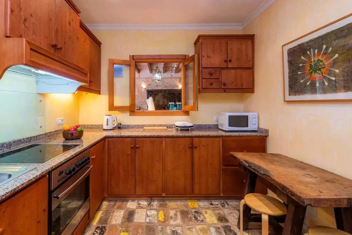 Kitchen or kitchenette in Es Revellar Art Resort - Adults Only