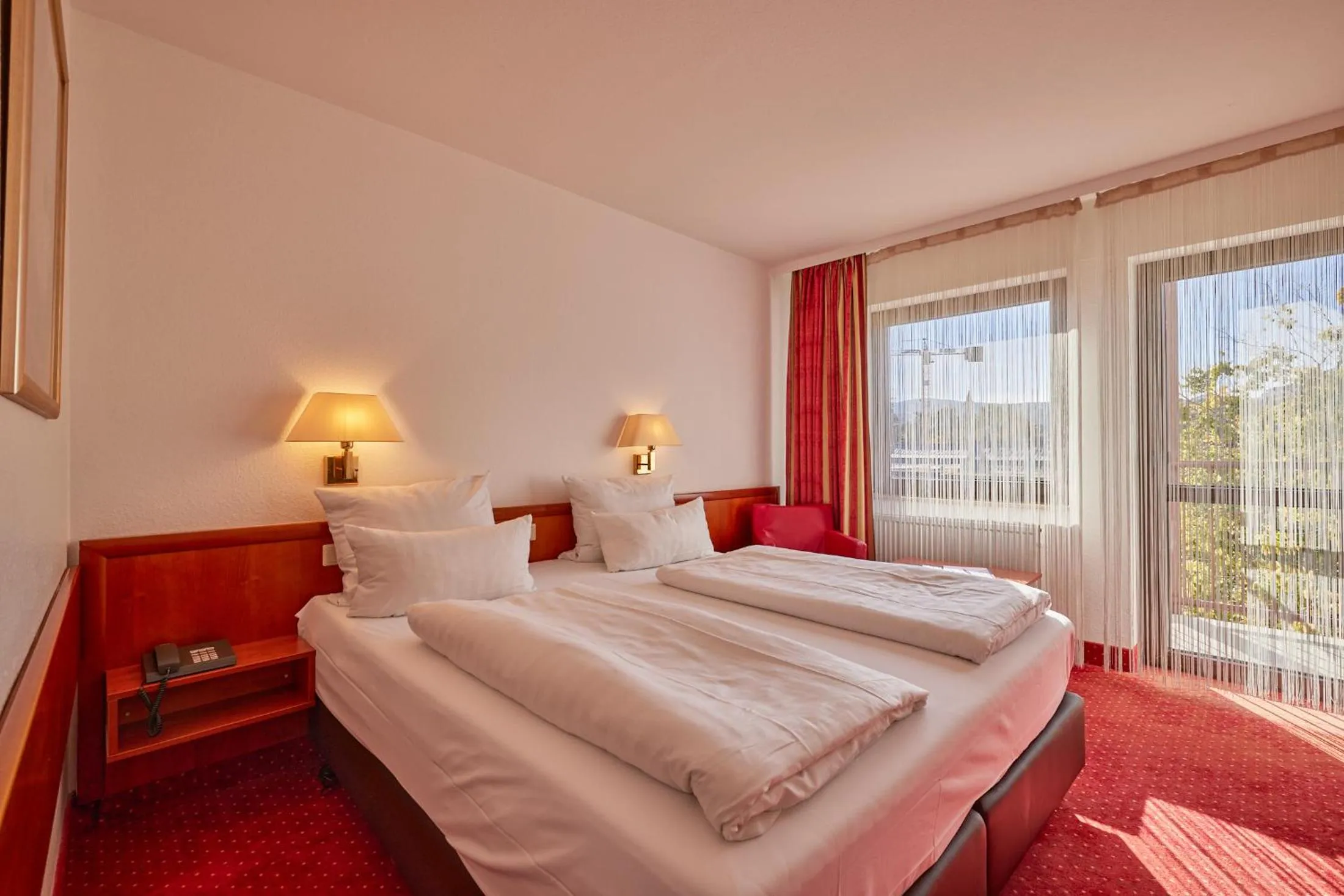 Photo of the whole room, Bed in Mercure Hotel Bad Duerkheim An Den Salinen