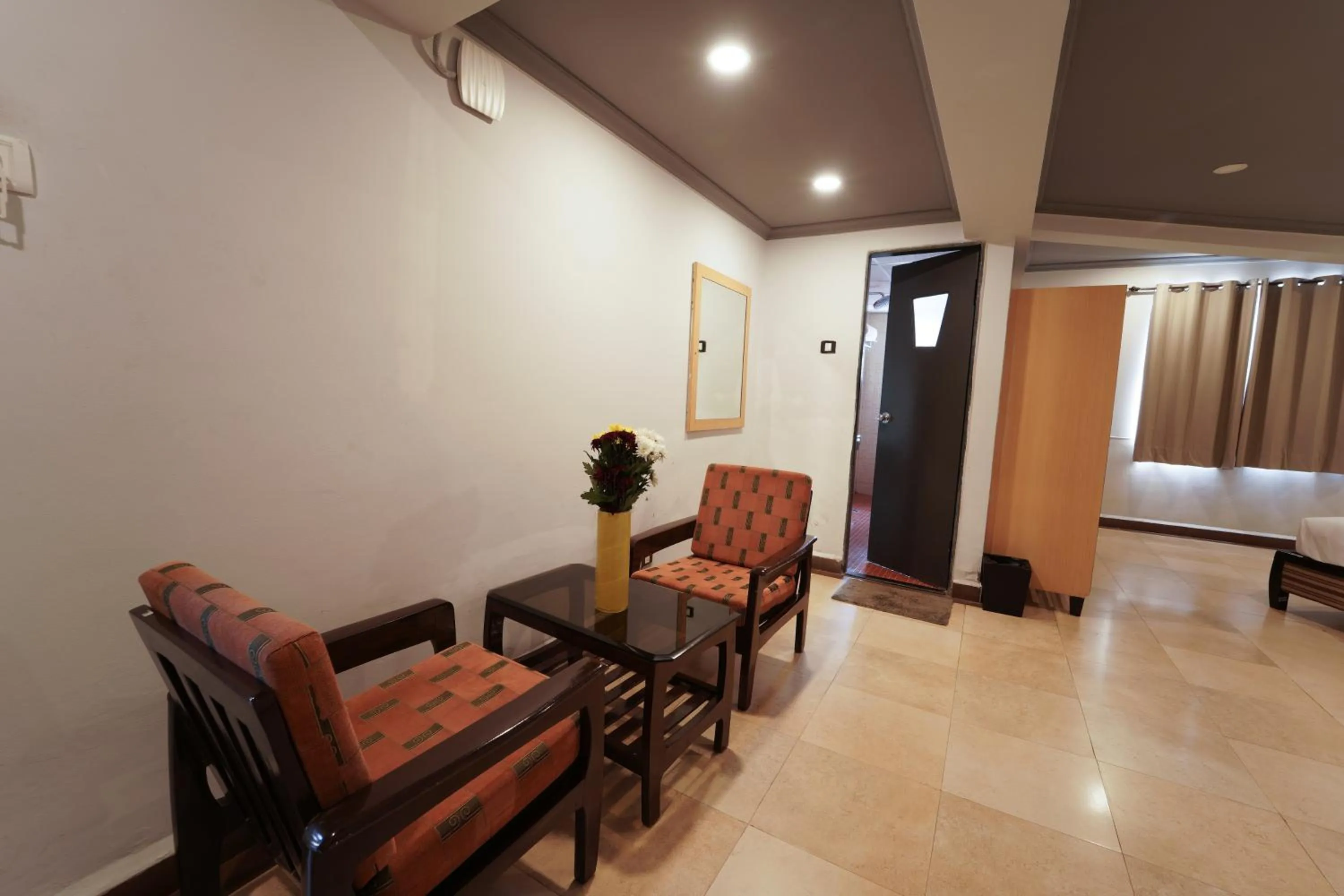 Seating area, Bed in The Treat Hotel