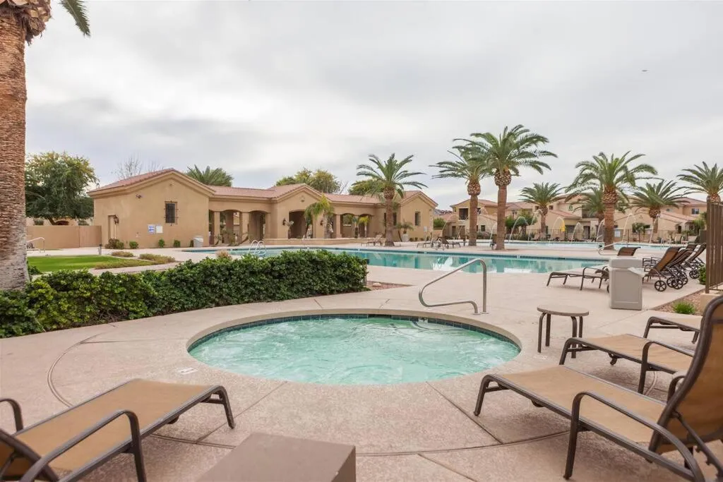 Gated townhouse with 2 suites, heated pool, hot tub