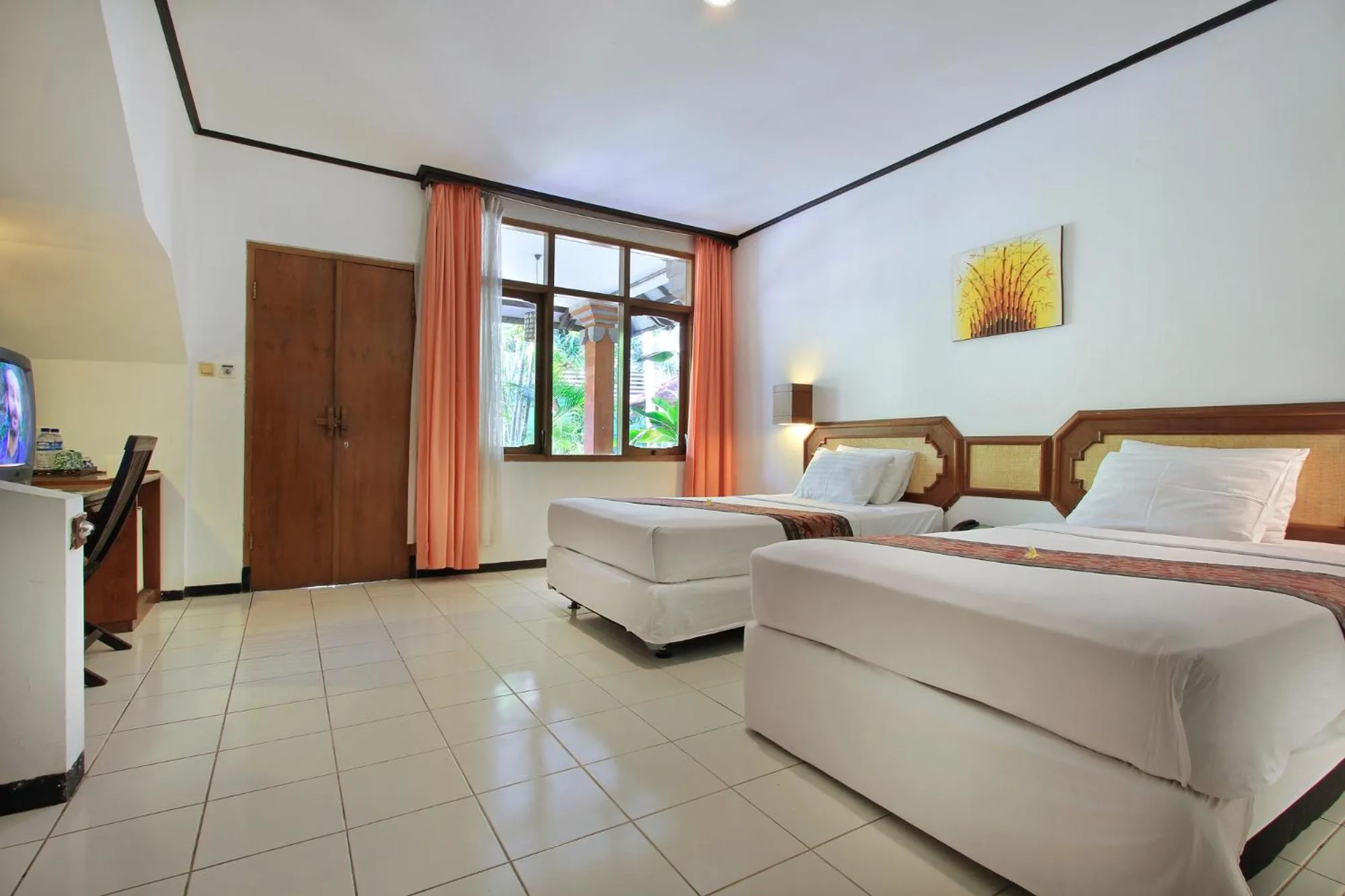 Bed in Puri Naga Beachfront Cottages